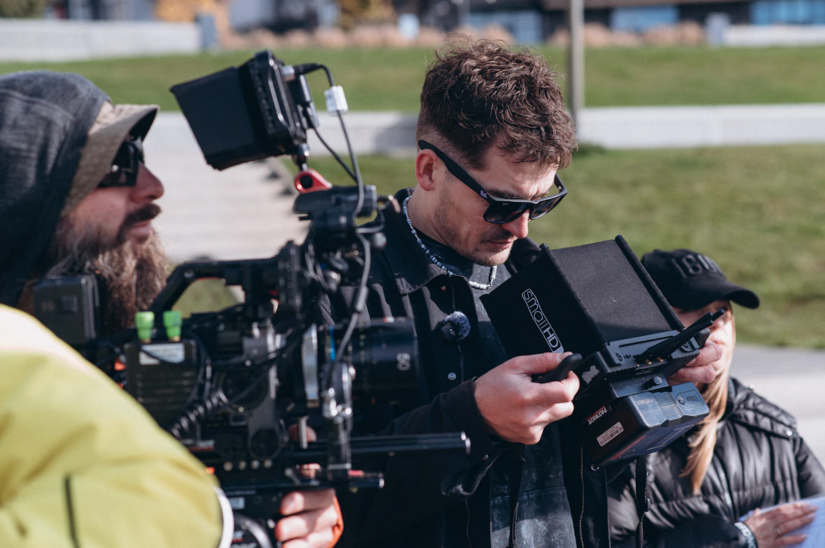Filmmakers reviewing footage on a camera monitor during a production test