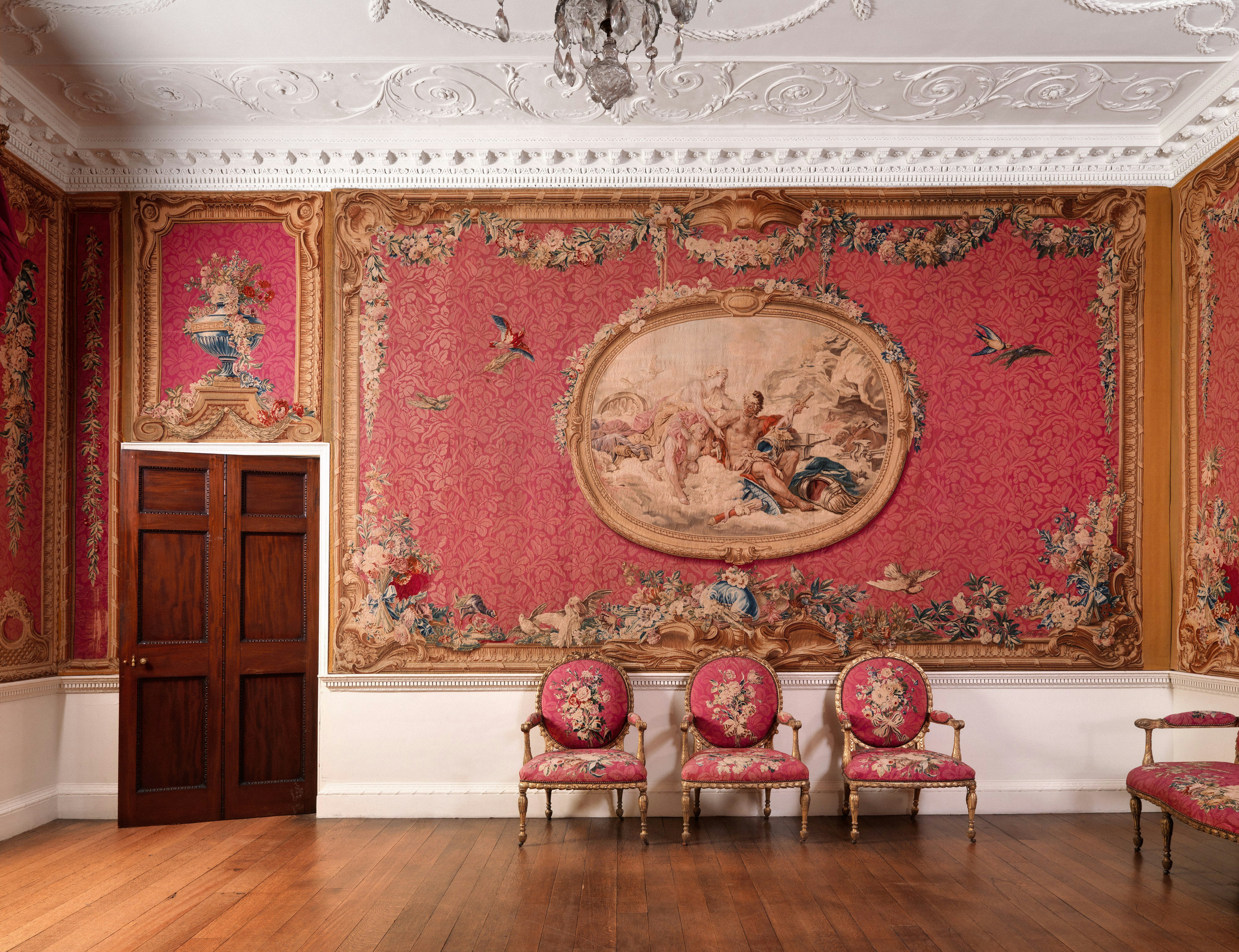Grand room with large red tapestry and three ornate chairs - Free Photo ...