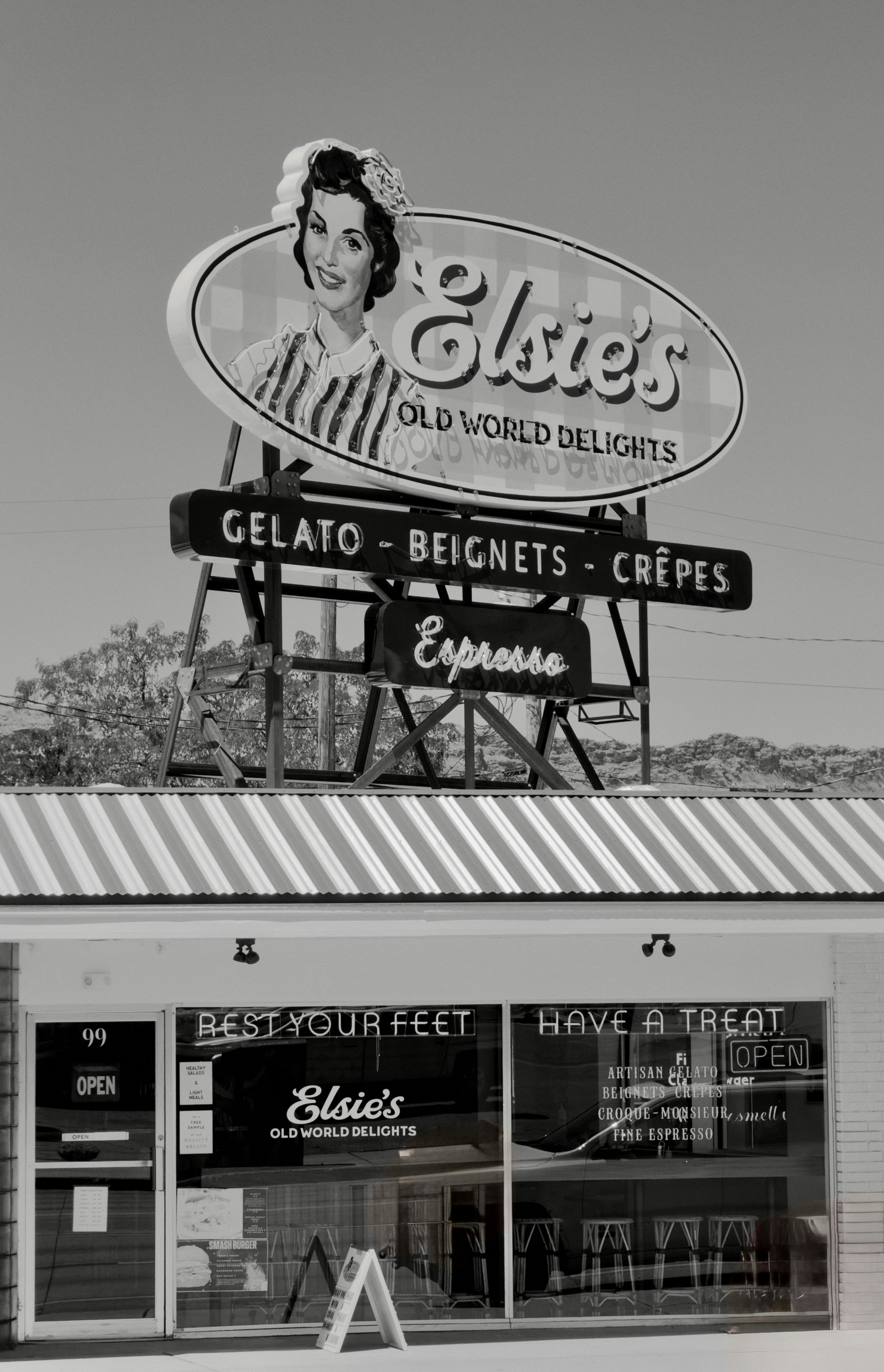 Vintage elsie's old world delights sign and storefront