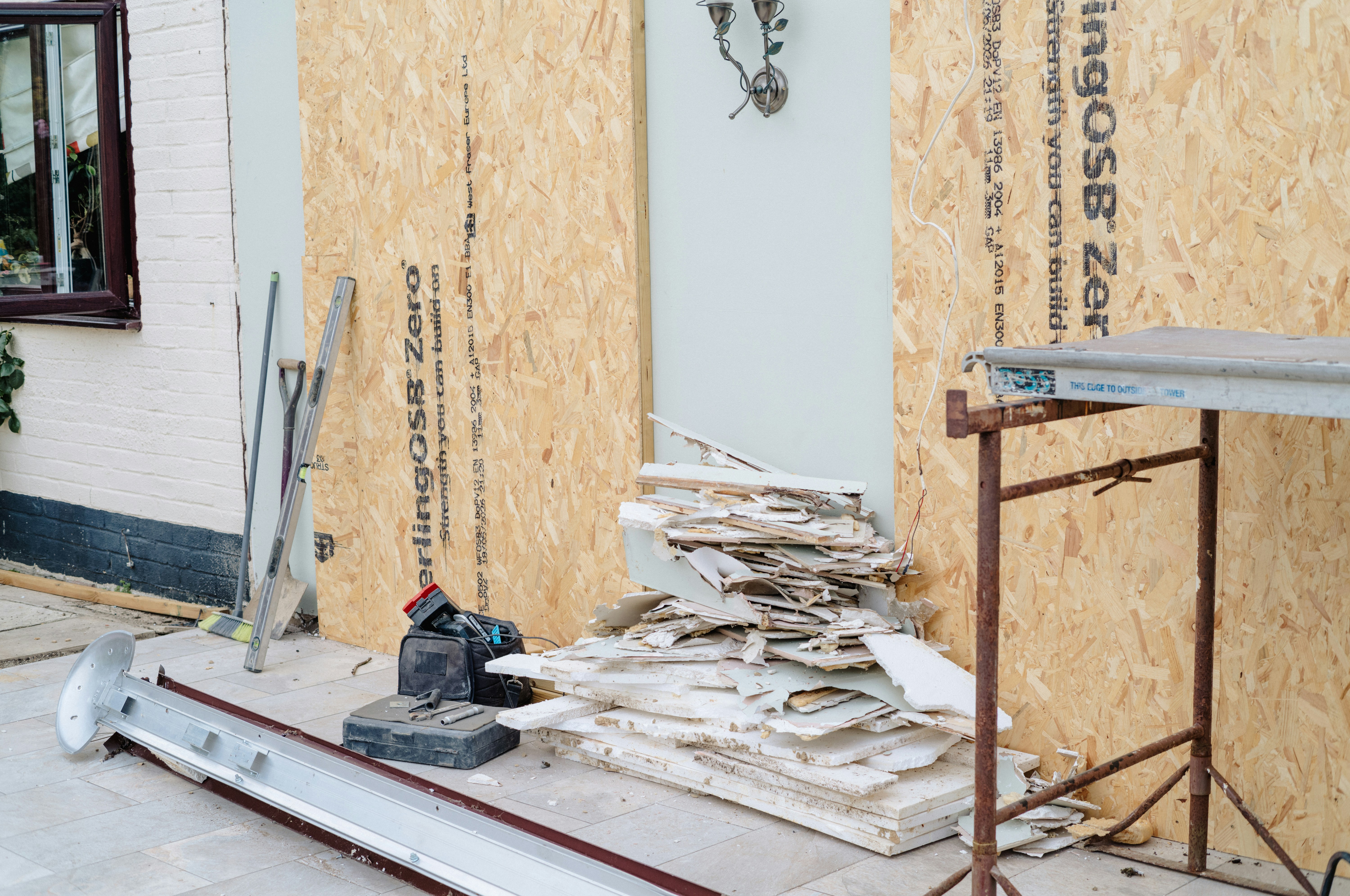 Building renovation with wooden panels and construction debris
