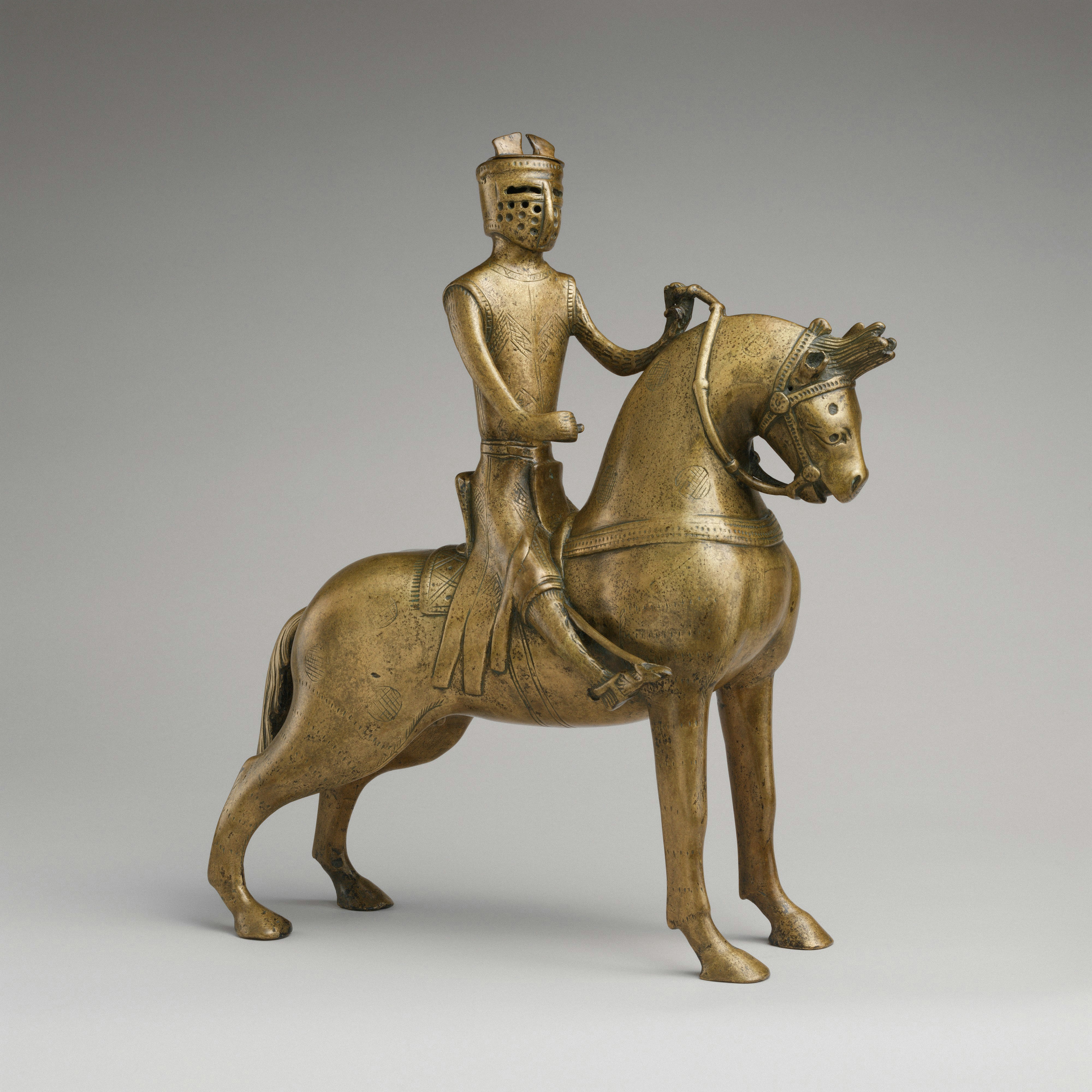 A bronze statuette of a knight riding a horse