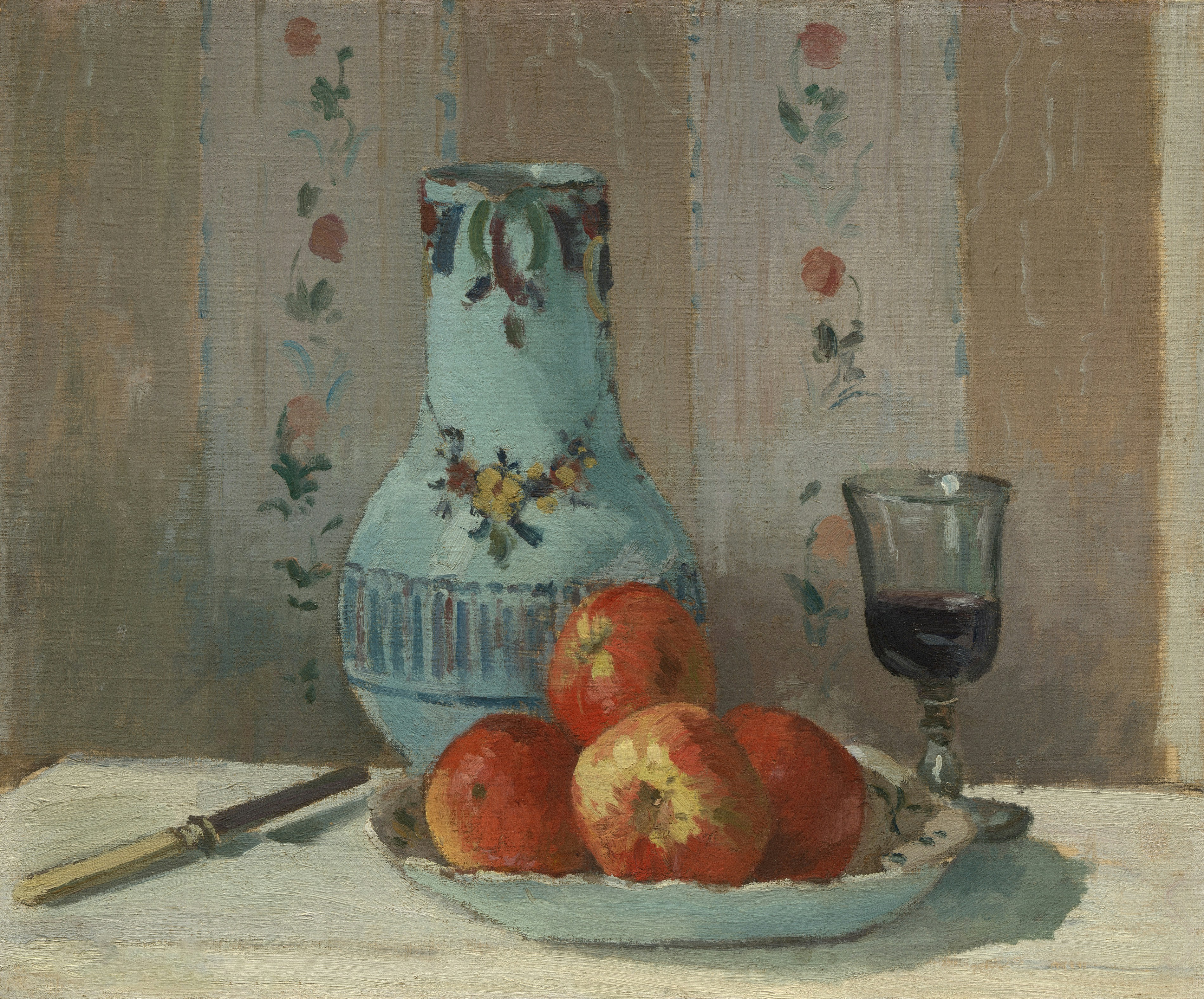 Blue vase, red apples, and wine glass on a table