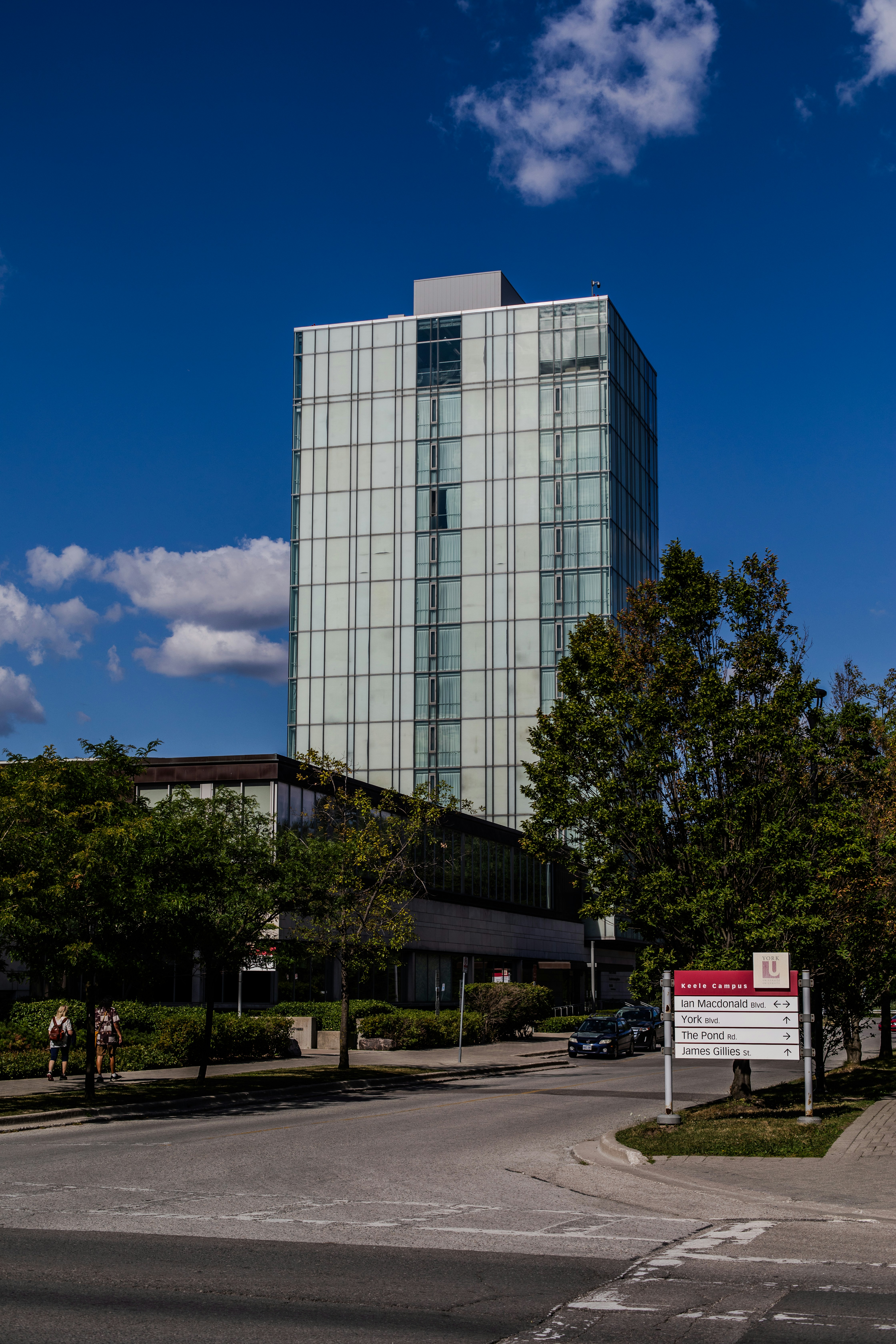 Modern glass high-rise building on a sunny day