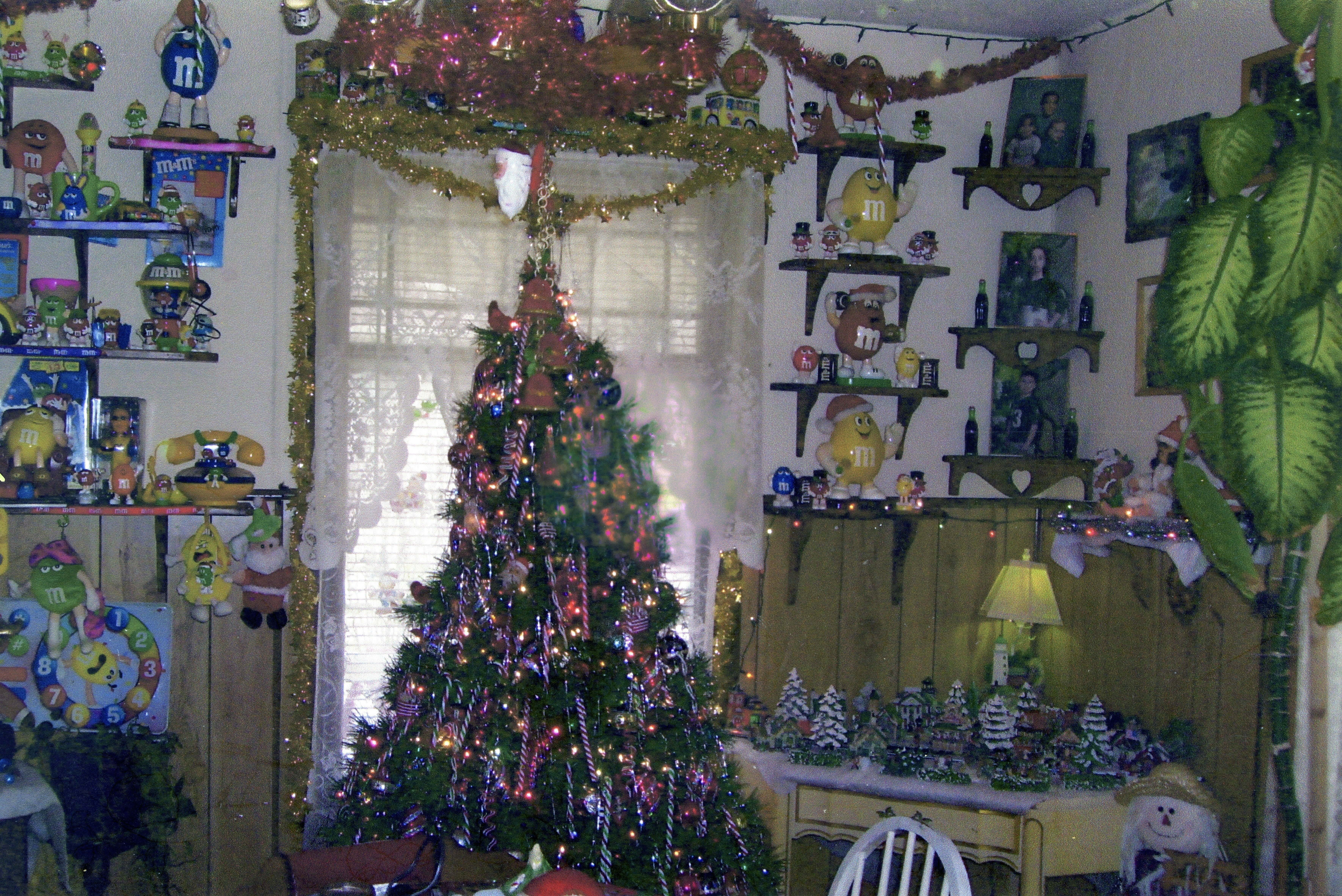 Festive room with a large, decorated christmas tree.