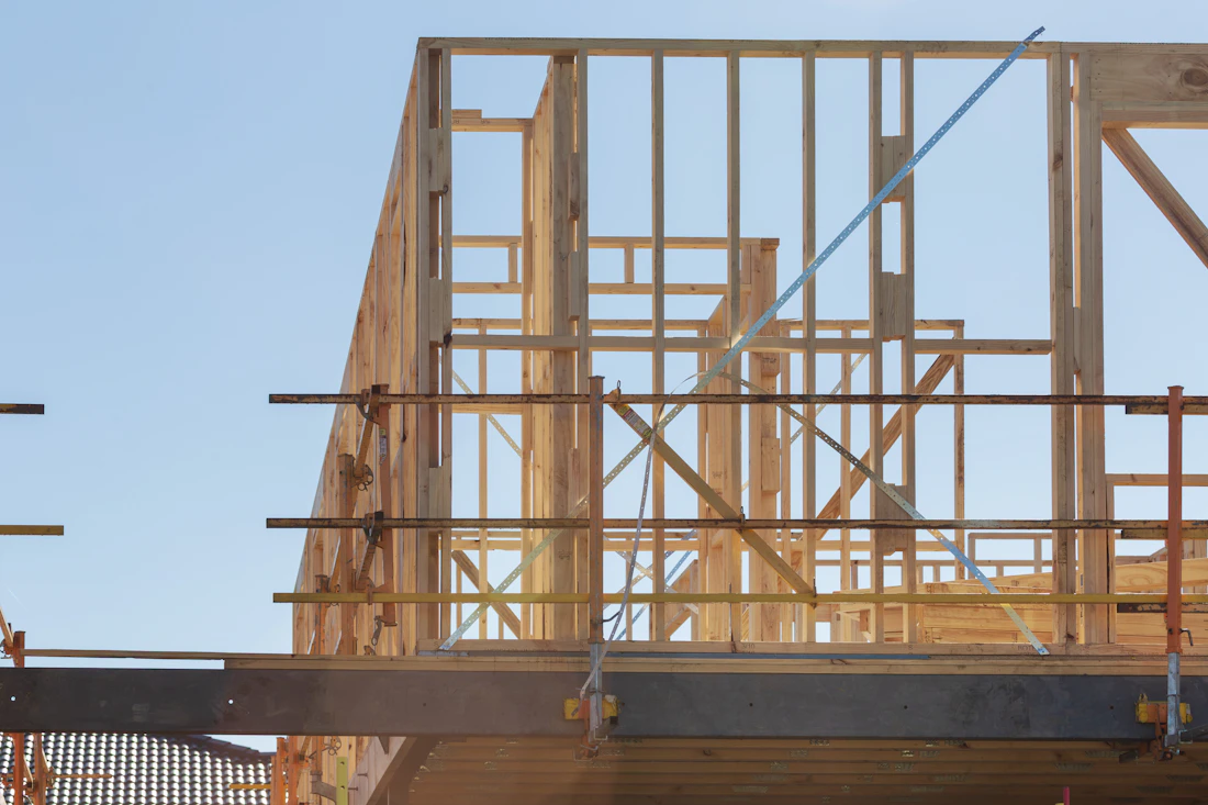 Wood framed house under construction with scaffolding