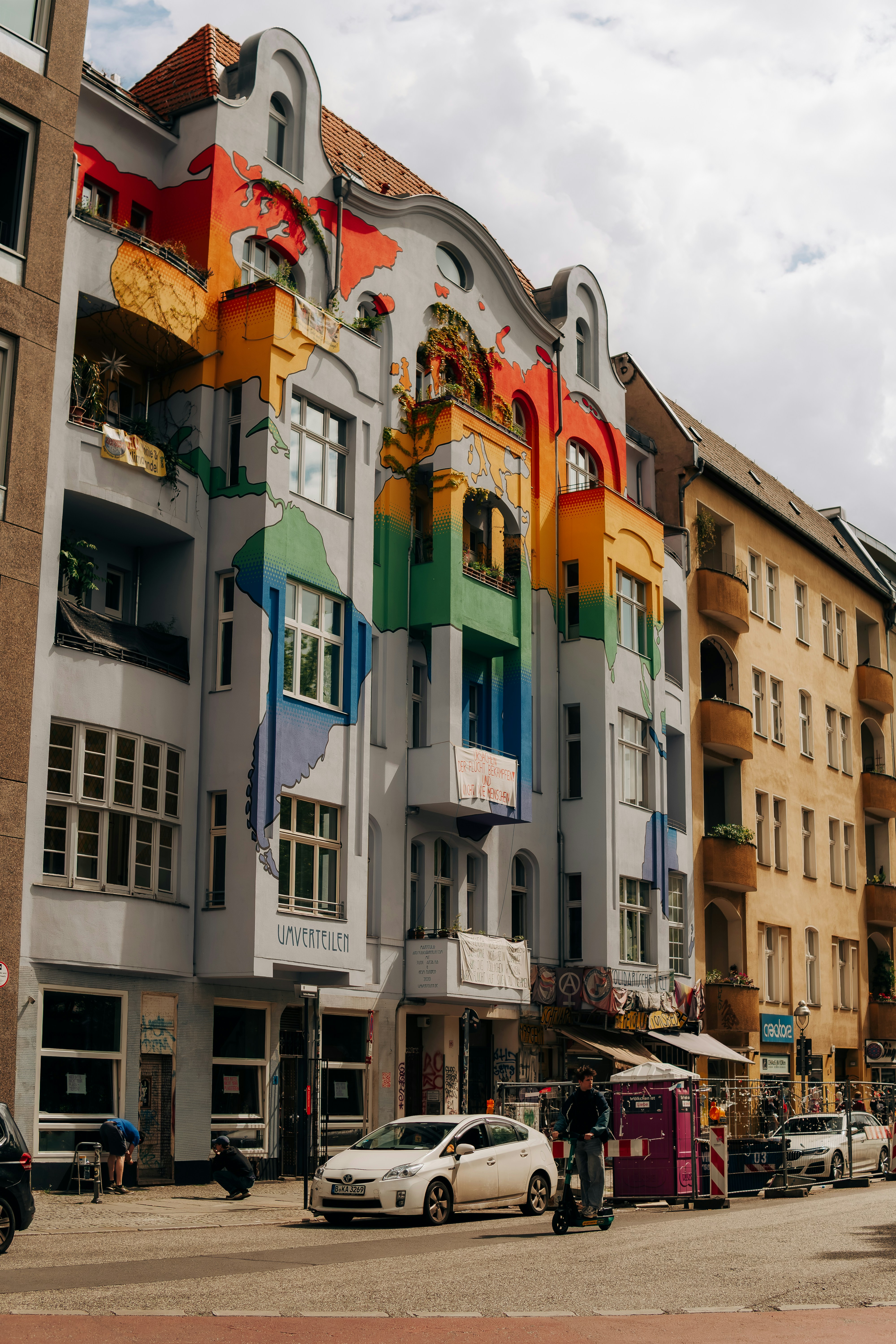 A building with a large, colorful rainbow mural