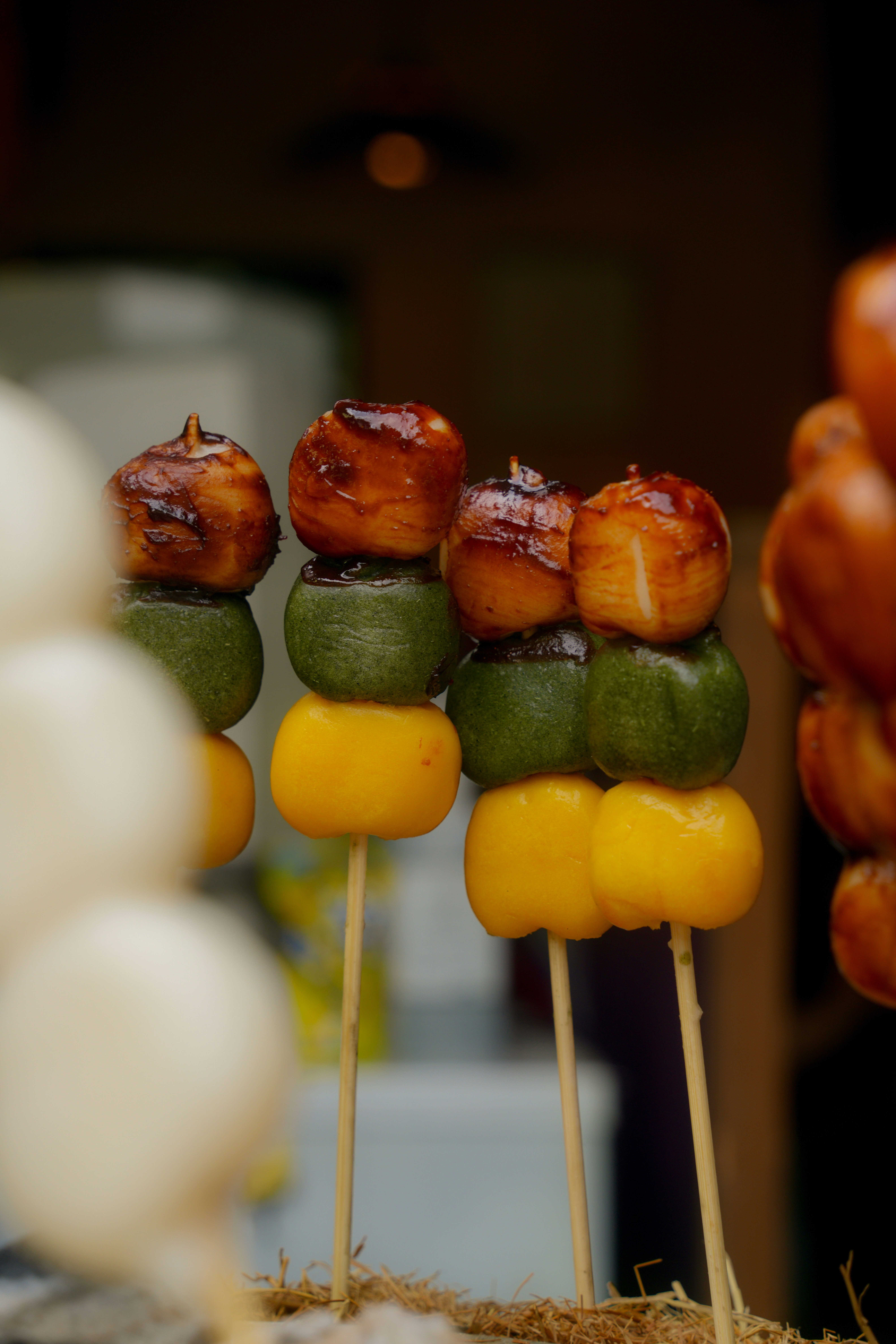 Japanese dango skewers with green, yellow, and caramelized mochi