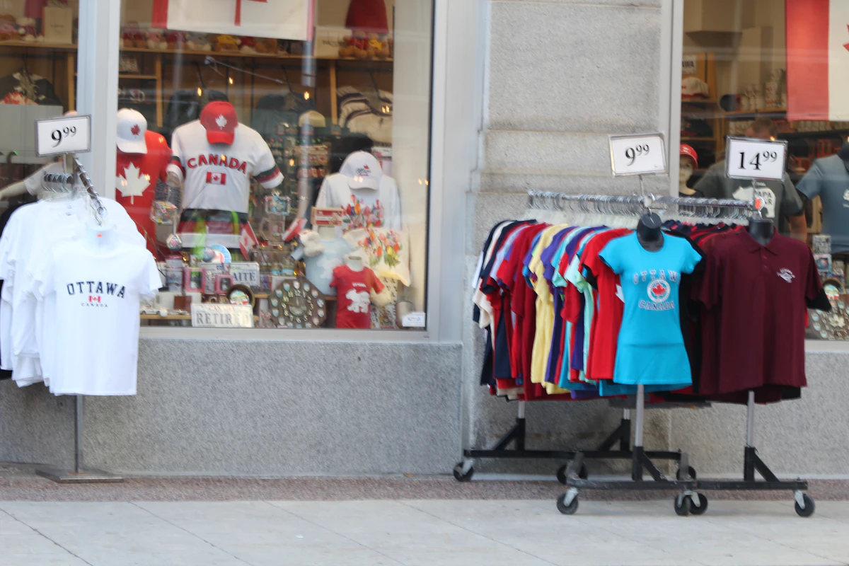 A Canadian souvenir shop with clothing displayed outside its storefront