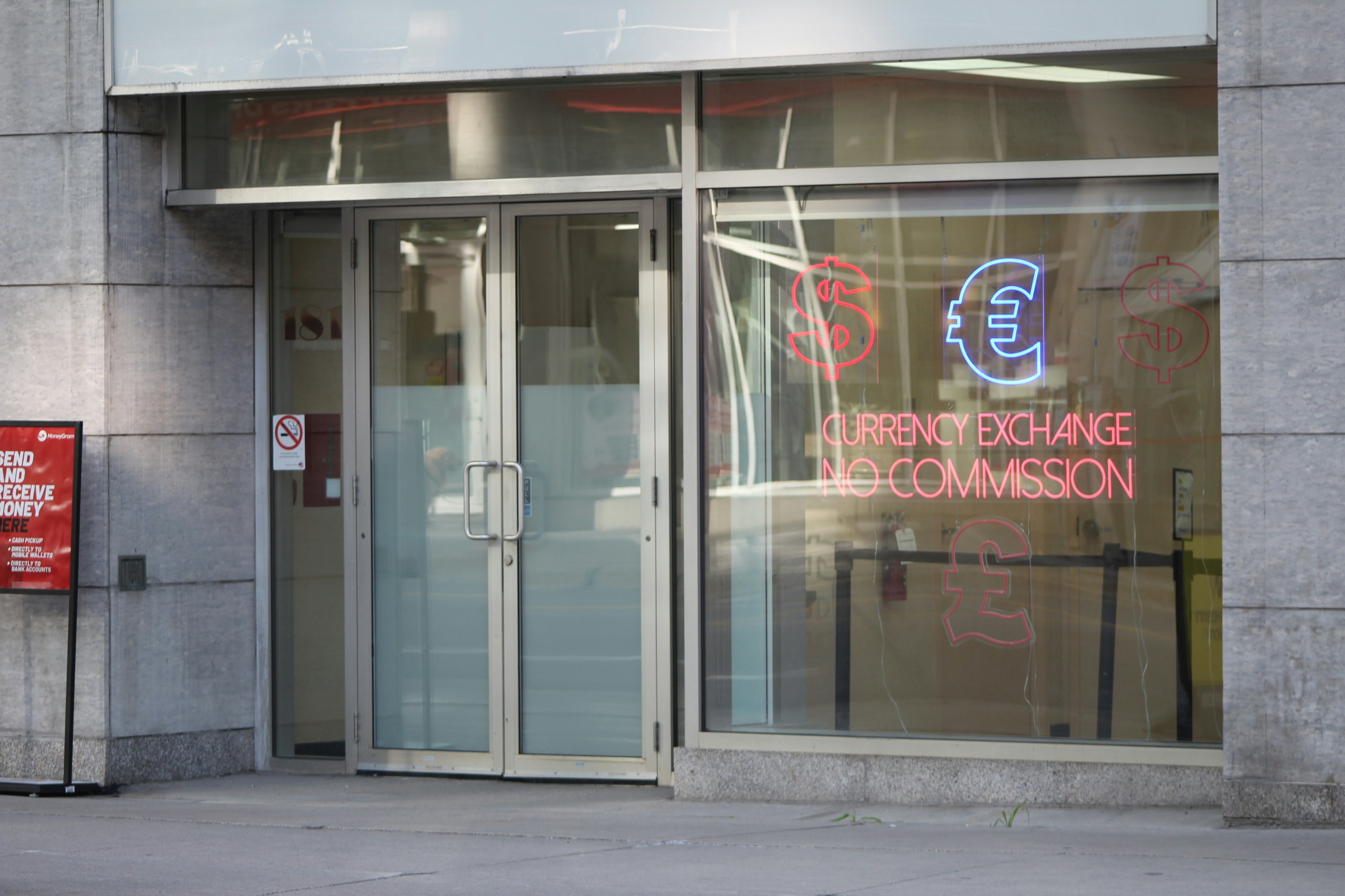 Exterior of a currency exchange office with neon euro sign