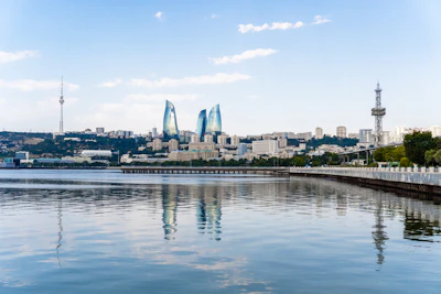 Baku skyline with the Flame Towers reflecting in the Caspian Sea