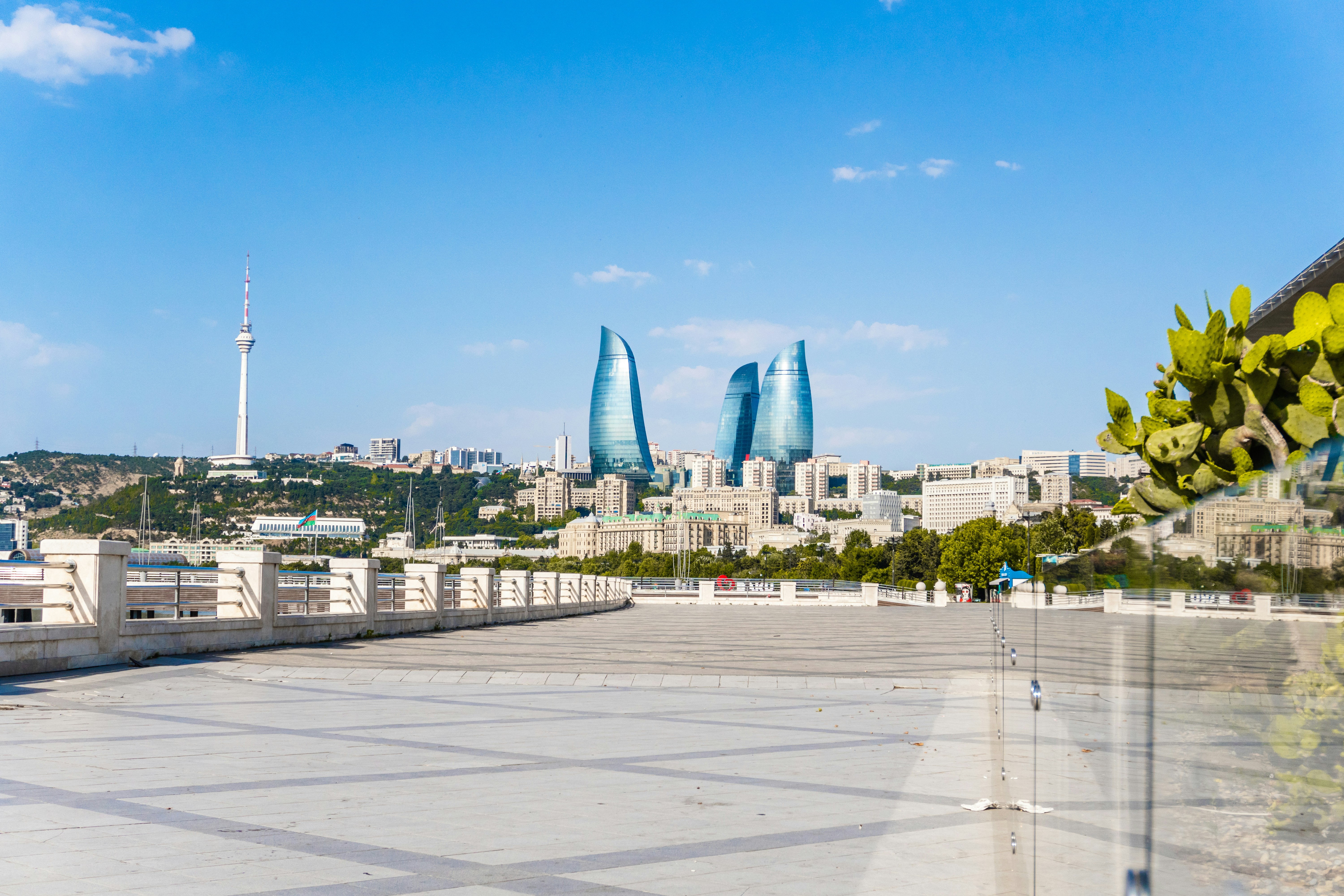 Modern baku skyline featuring flame towers and TV tower.