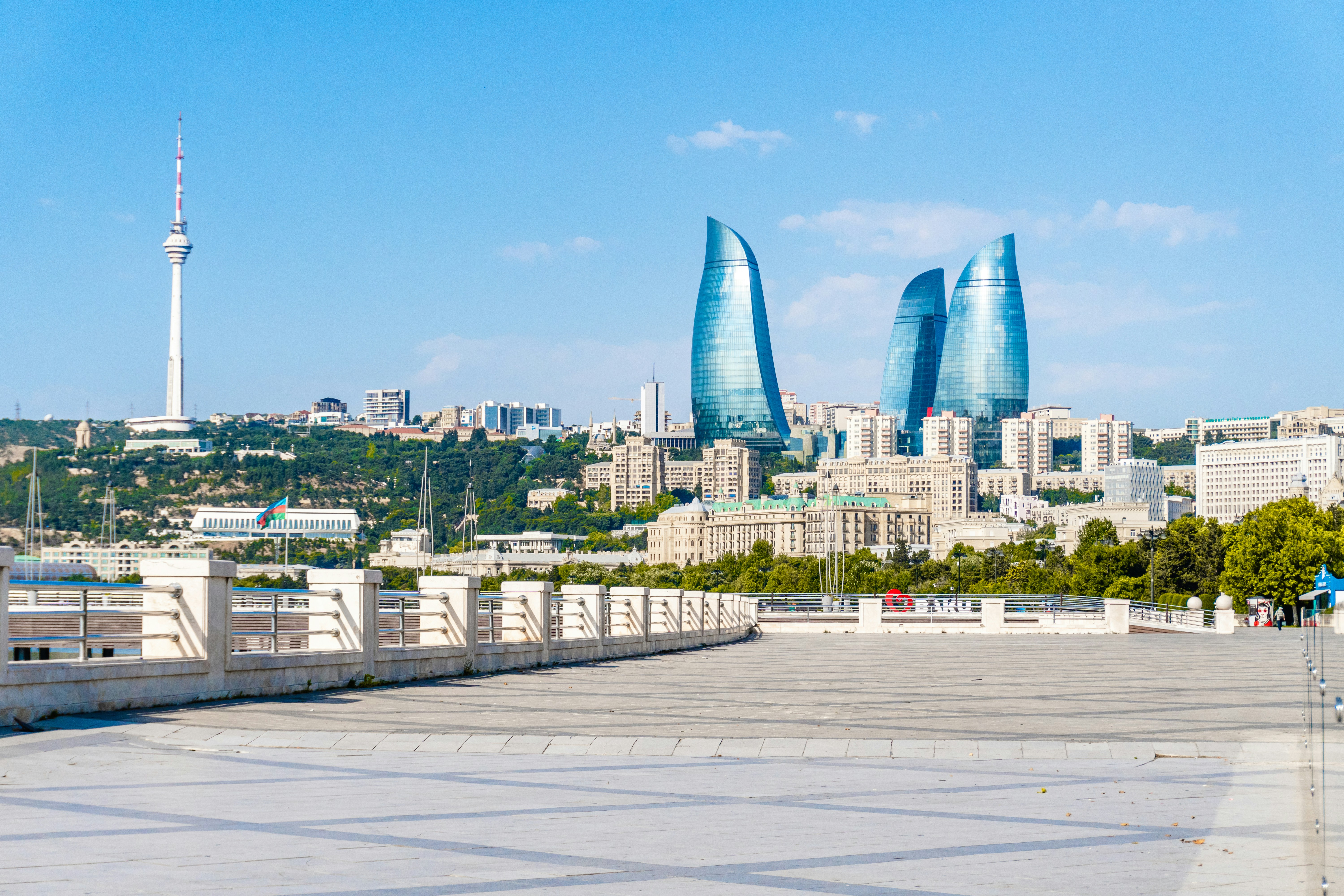Modern baku cityscape featuring flame towers and TV tower.