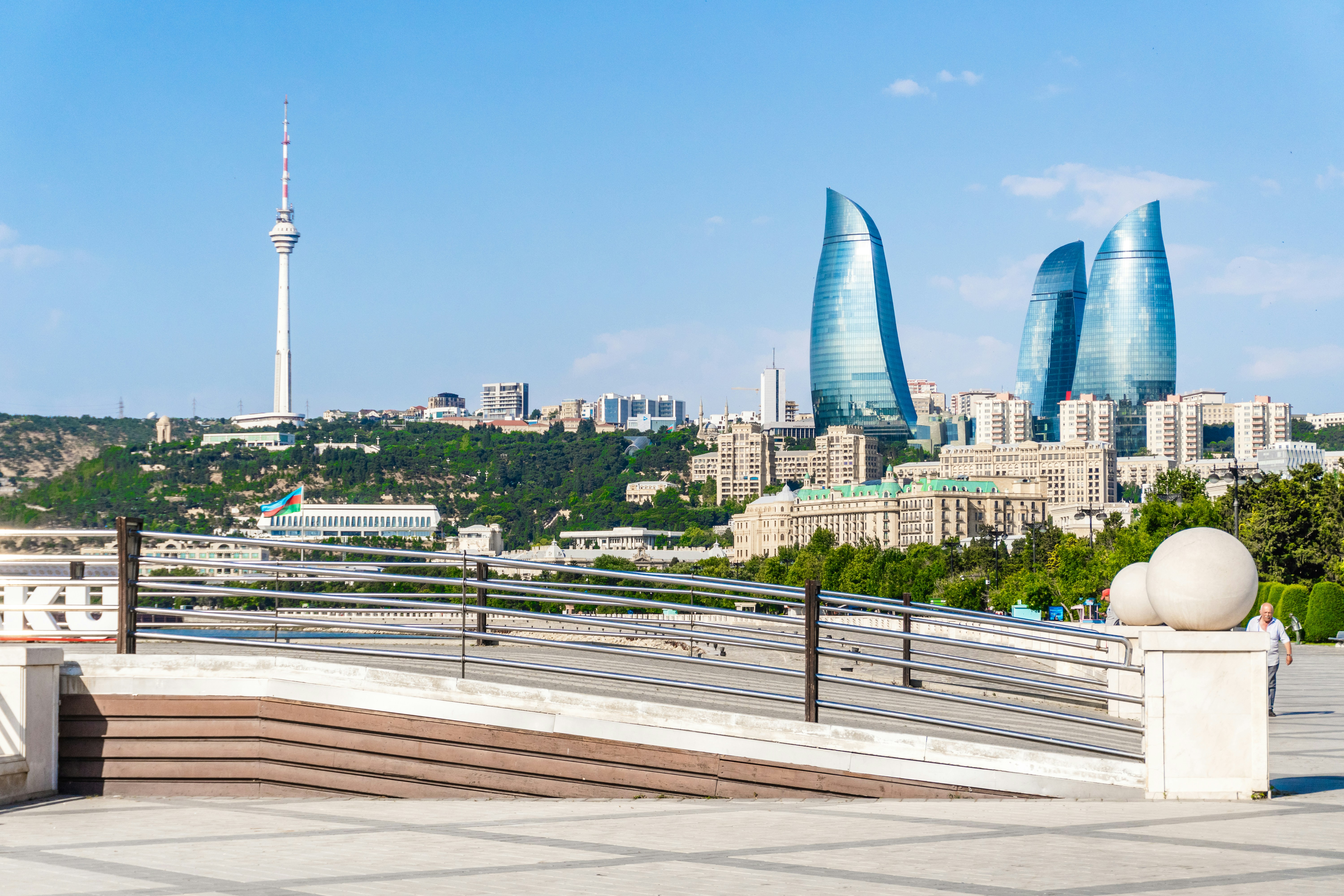 Modern baku skyline featuring flame towers and television tower.