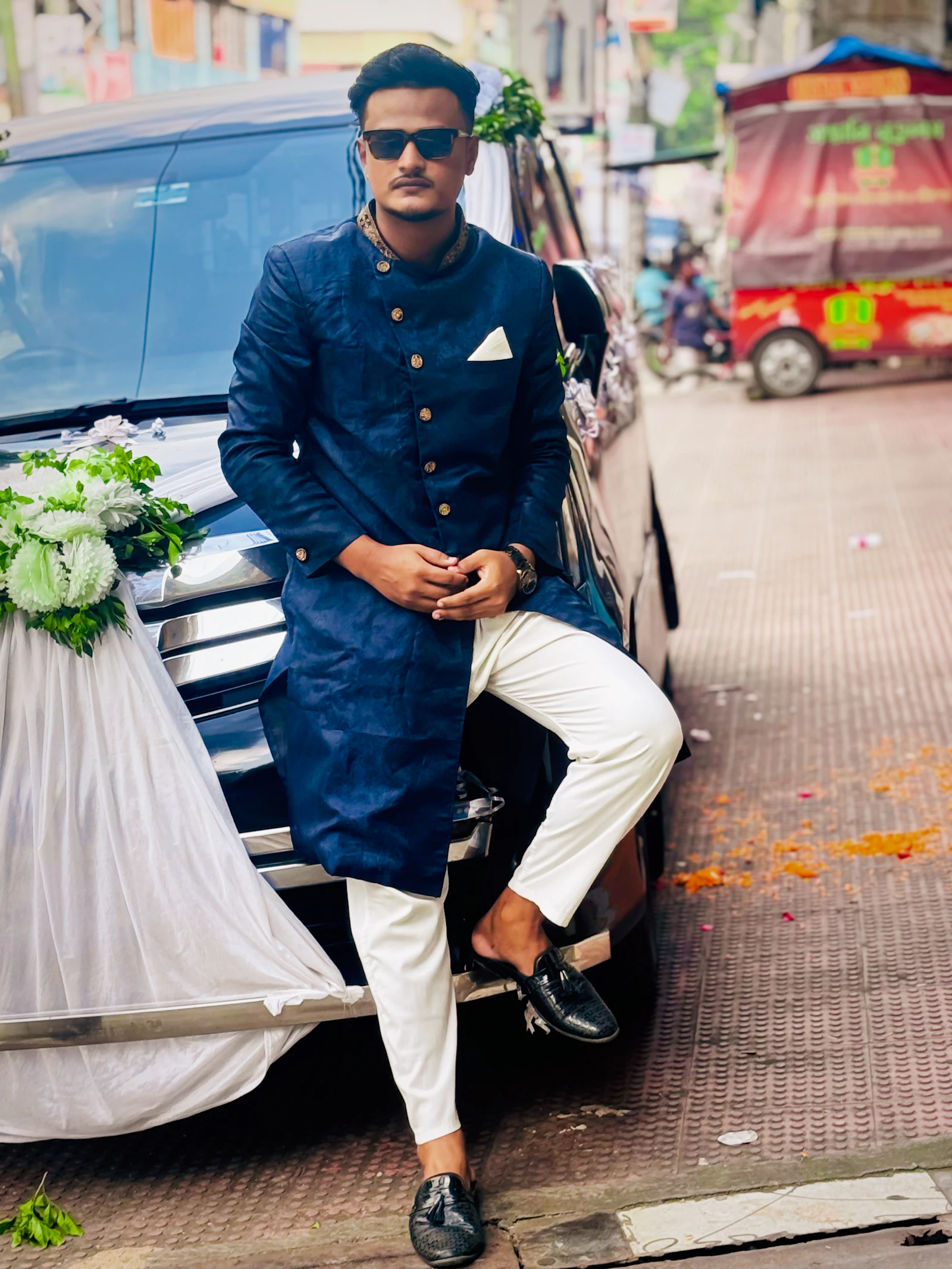 Man wearing a deep blue bandhgala with mandarin collar