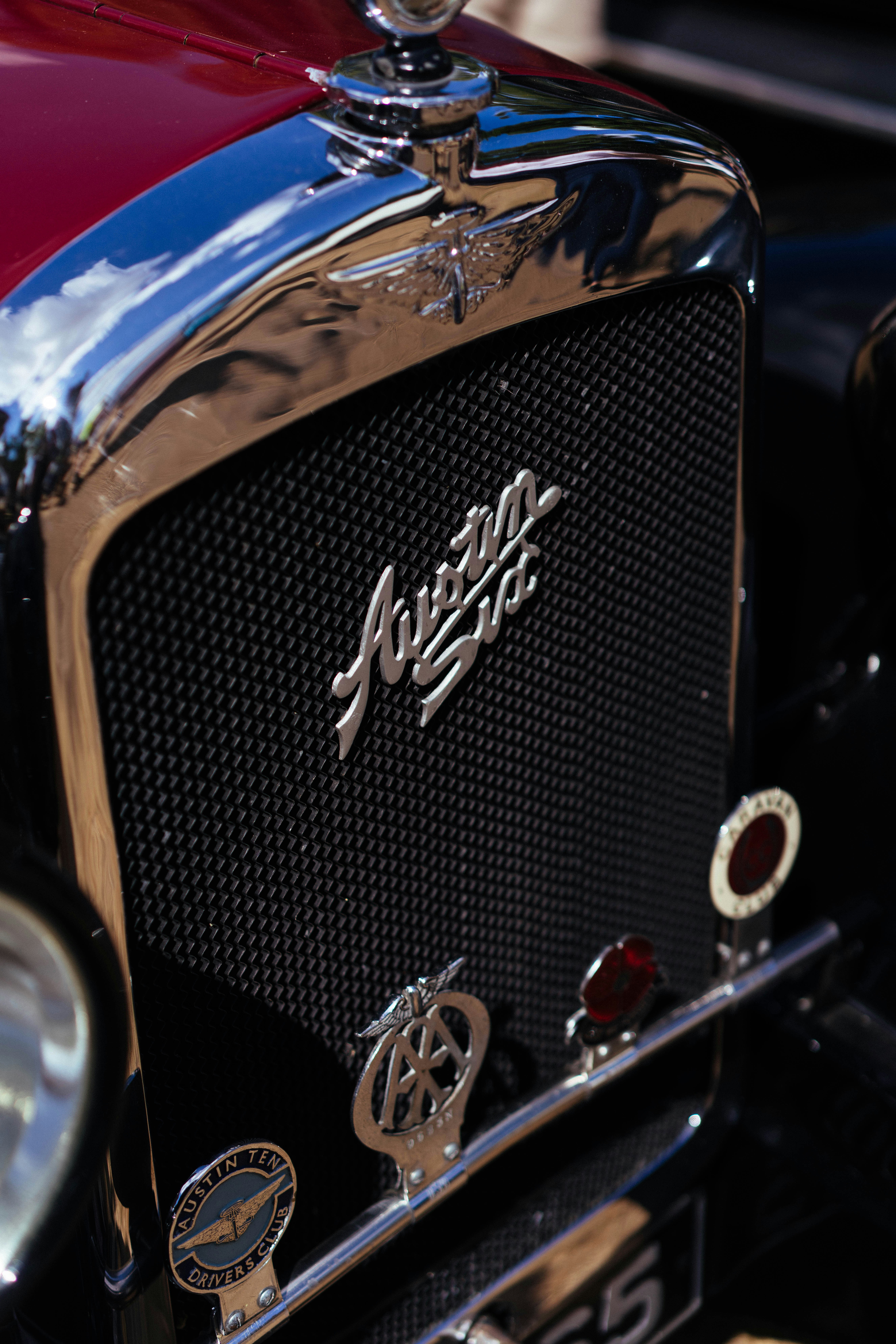 Vintage austin seven car grille with chrome details and badges.