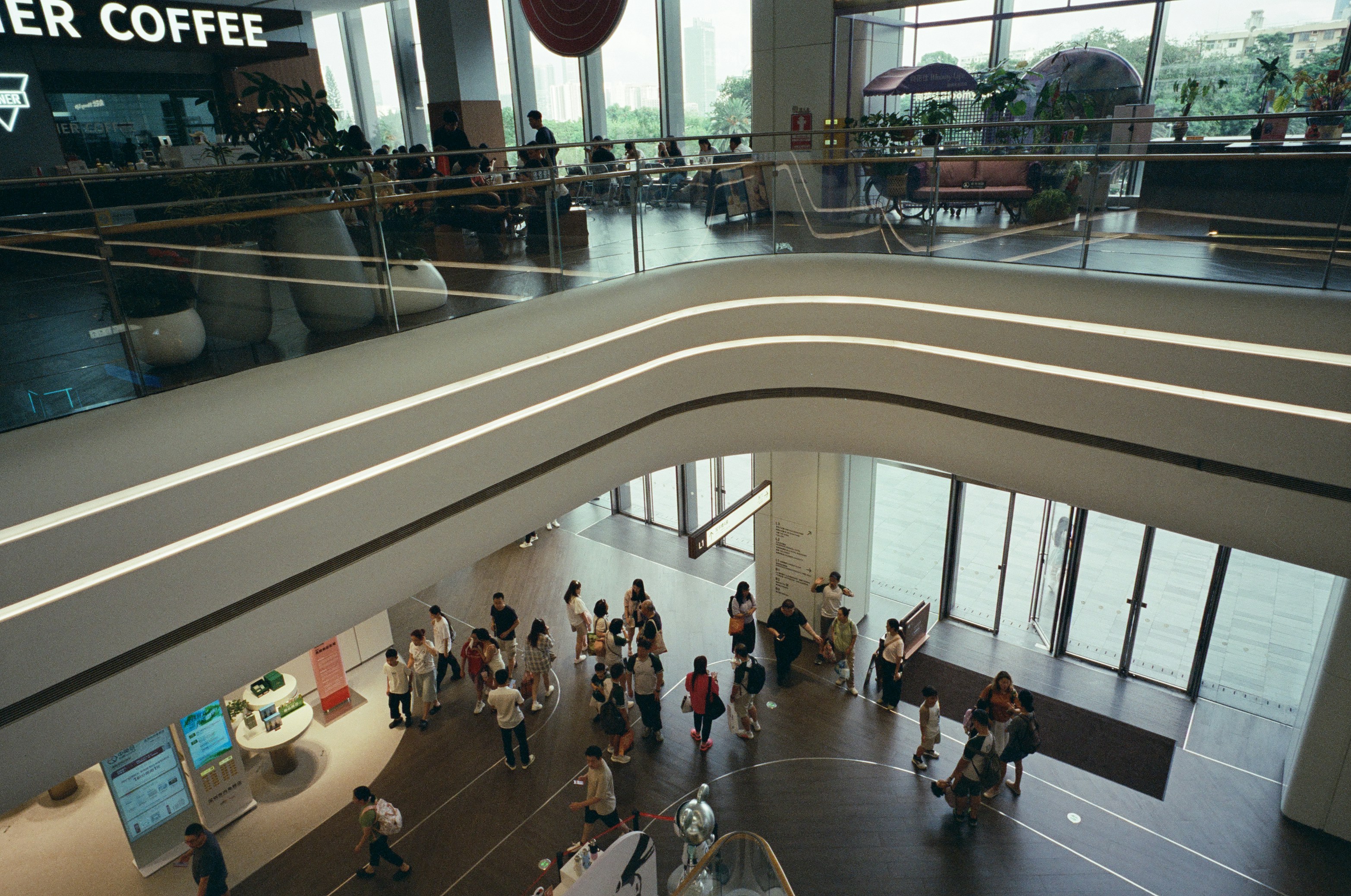 Shoppers on the ground floor of a modern shopping centre