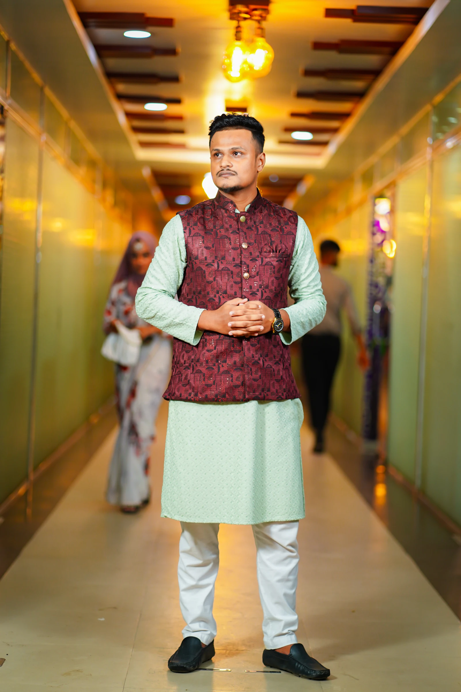 Man in a kurta and waistcoat