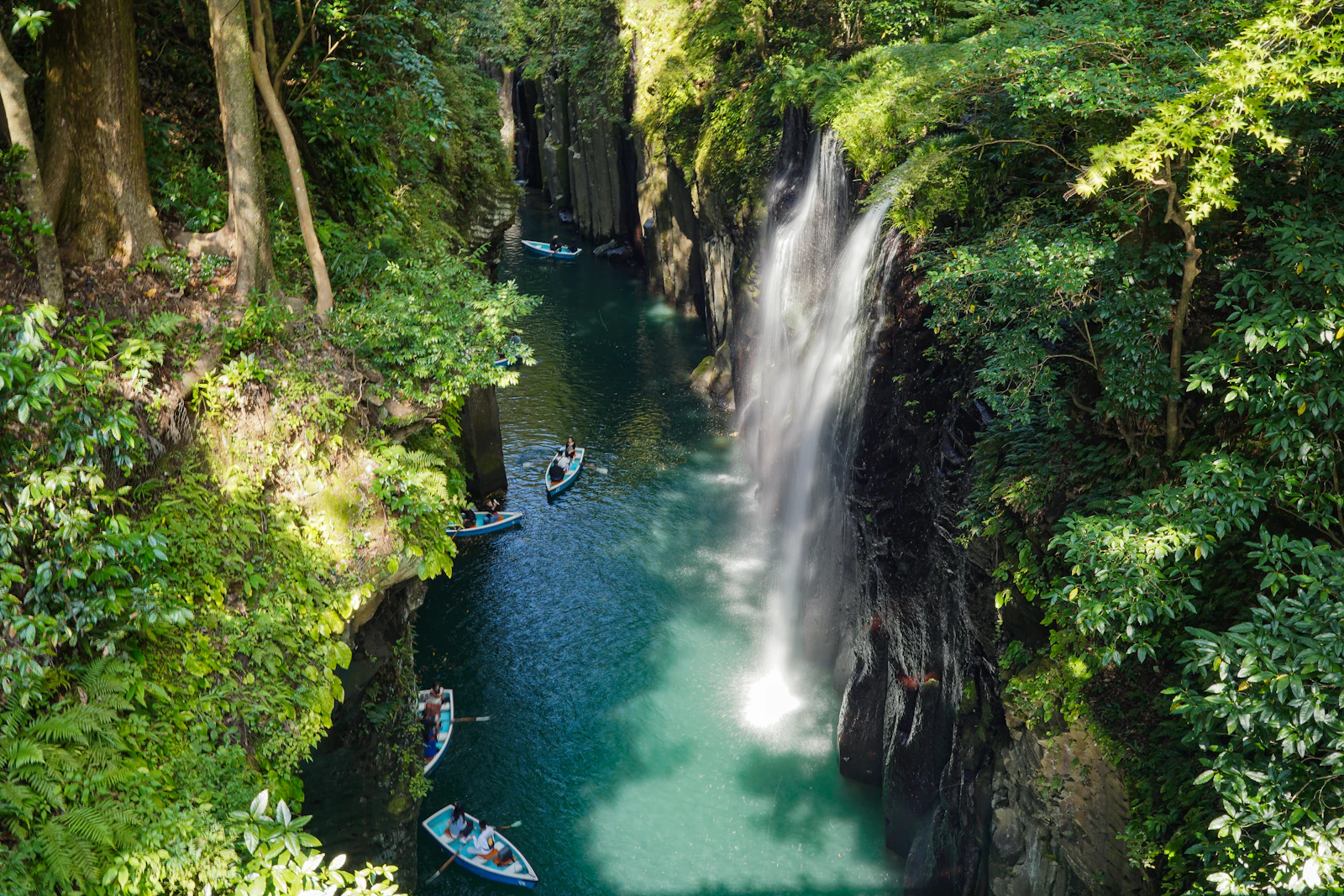 Rowboats below Manai Falls in Takachiho Gorge