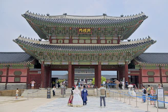 Majestic traditional korean palace gate with visitors
