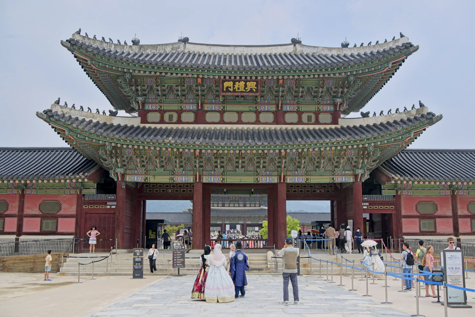 Majestic traditional korean palace gate with visitors