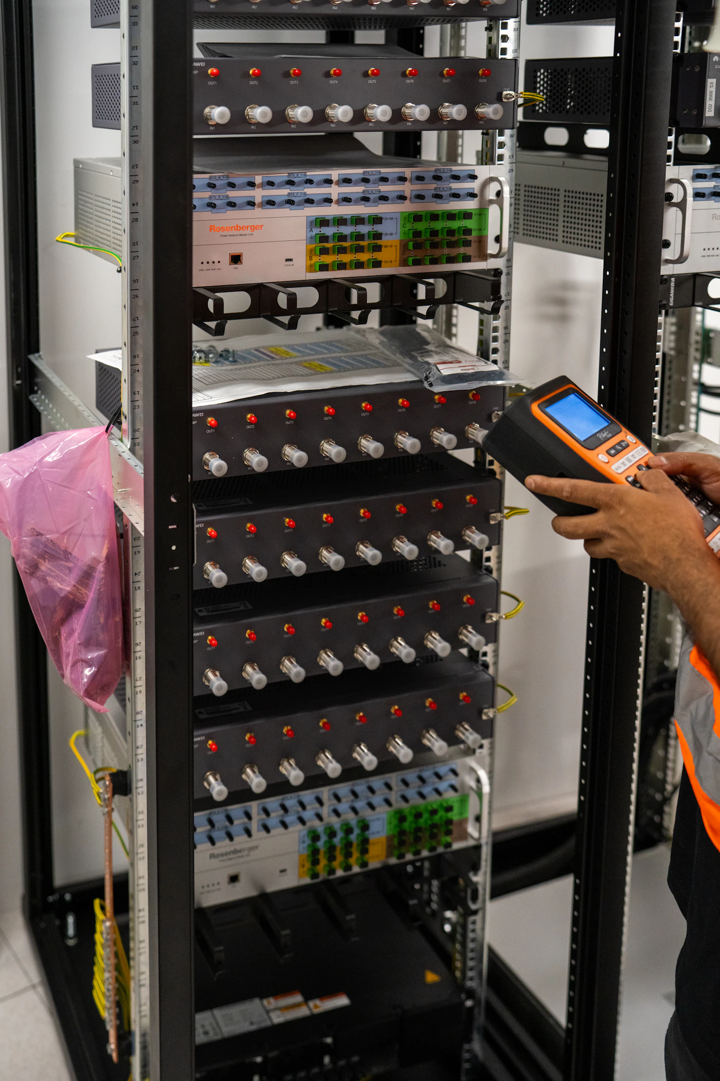 Technician working on a server rack