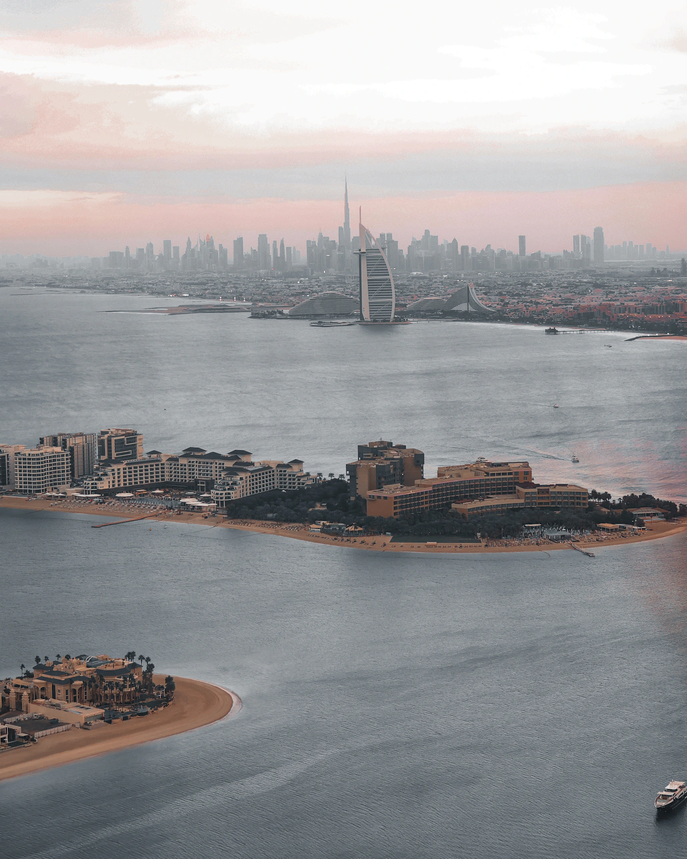 Aerial Dubai skyline and islands at sunset