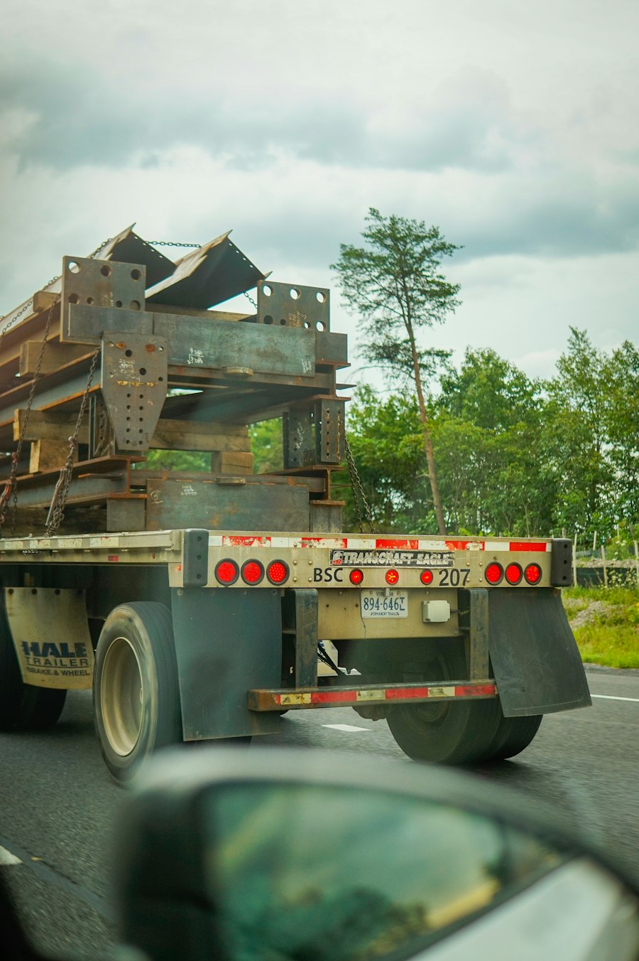 Flatbed truck loaded with heavy metal structures