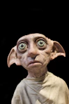 Dobby the house-elf against a dark background