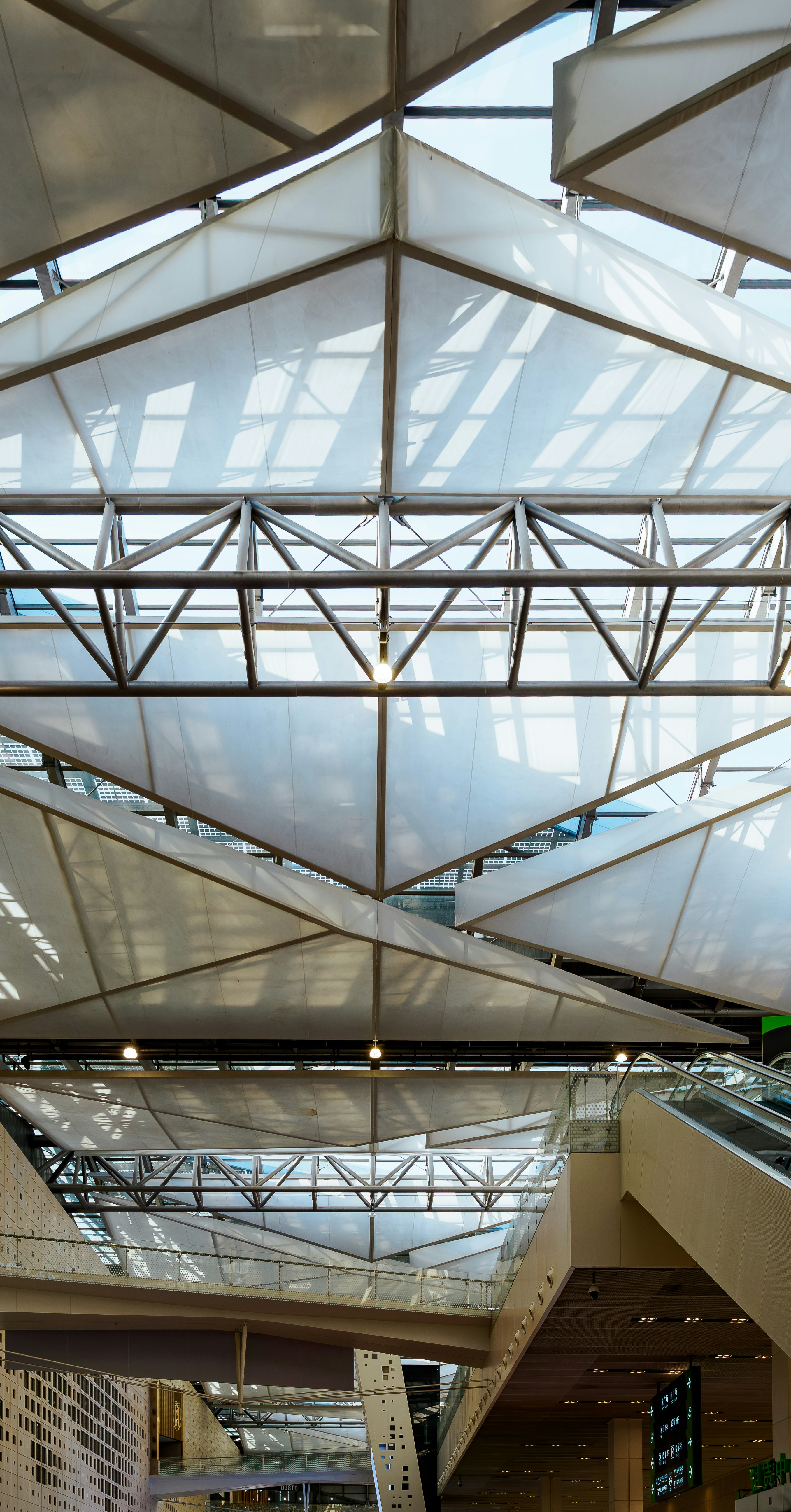 Modern building interior with geometric ceiling and skylights
