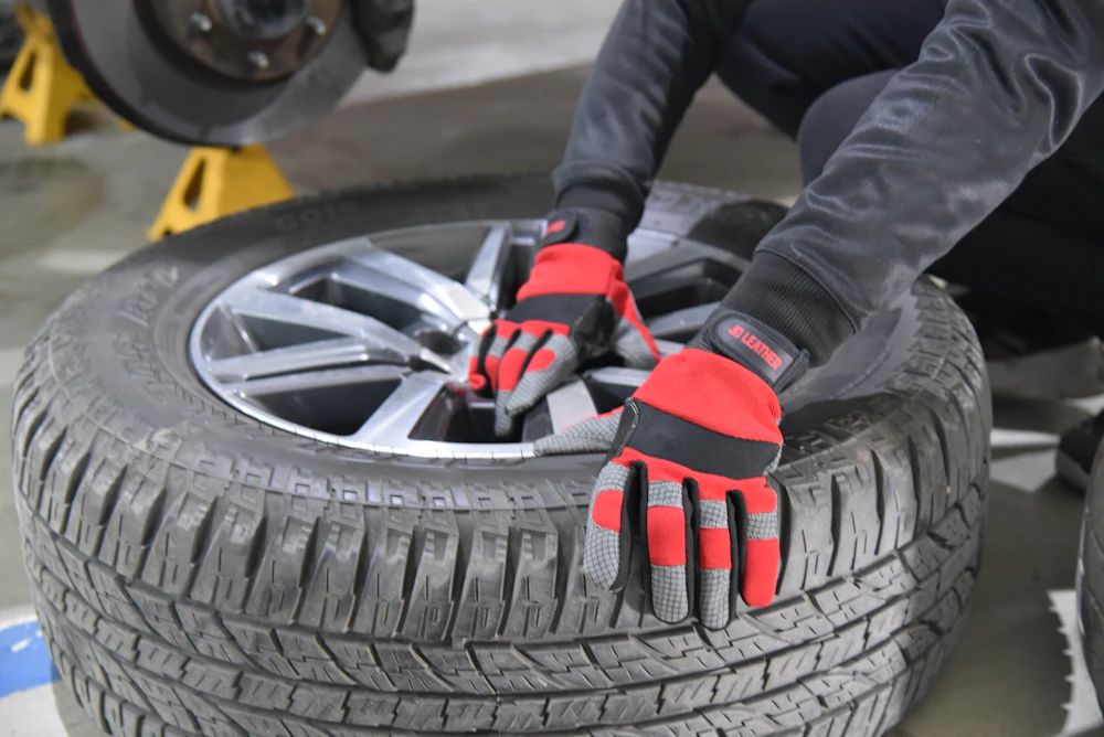 Mechanic working with a tire in a workshop