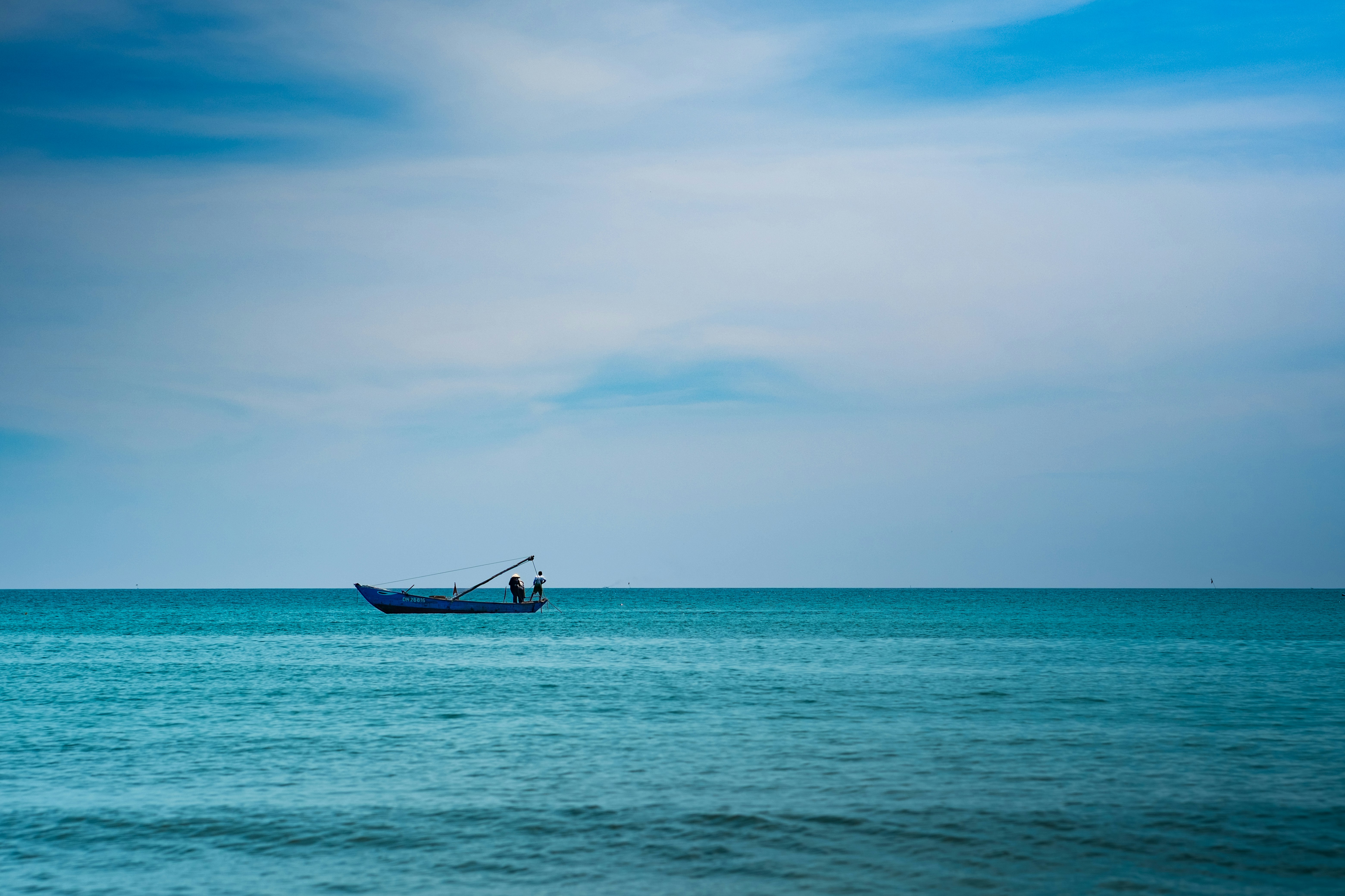 Small boat on a calm blue sea