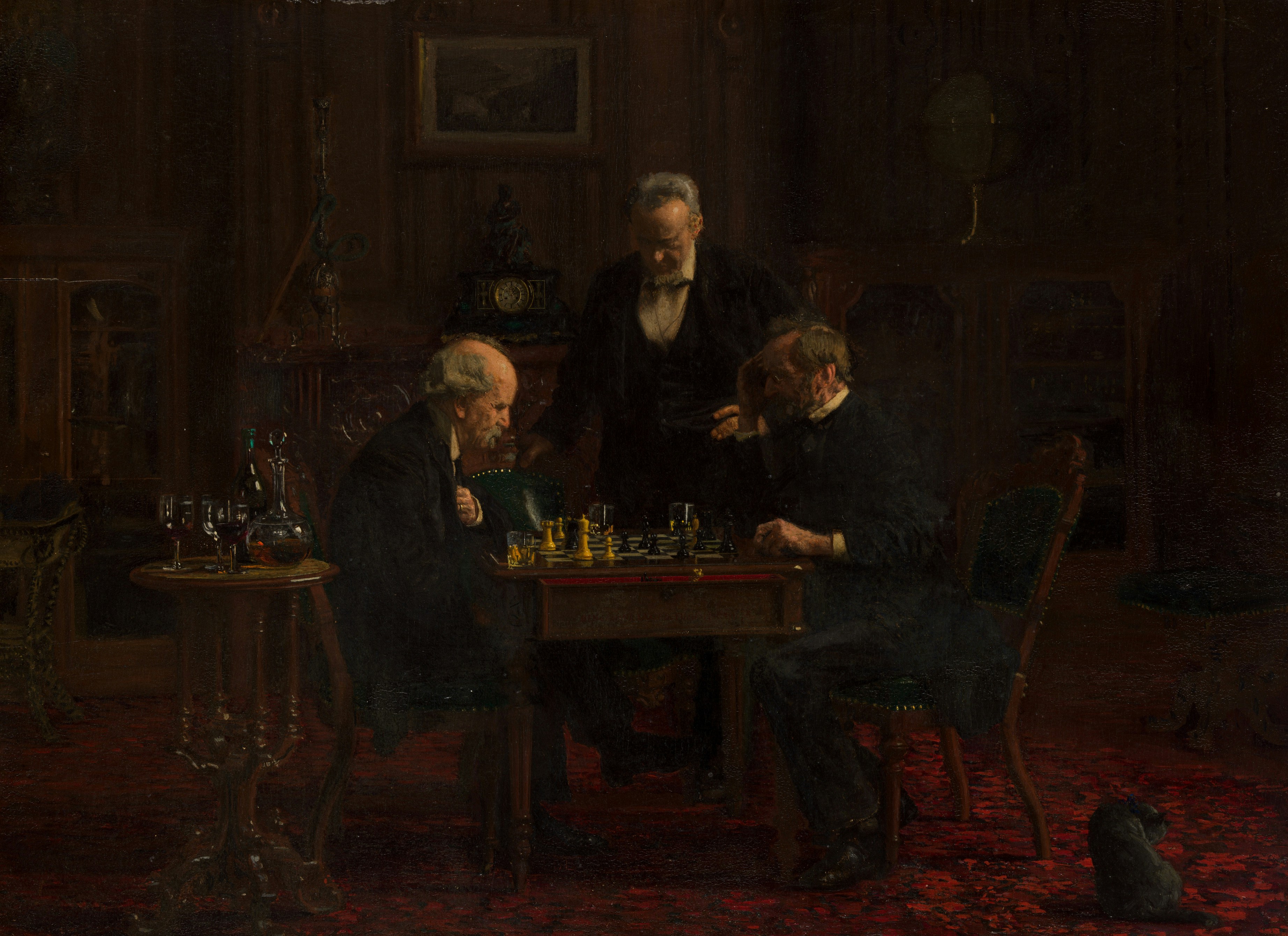 Three men playing chess in a dimly lit room.