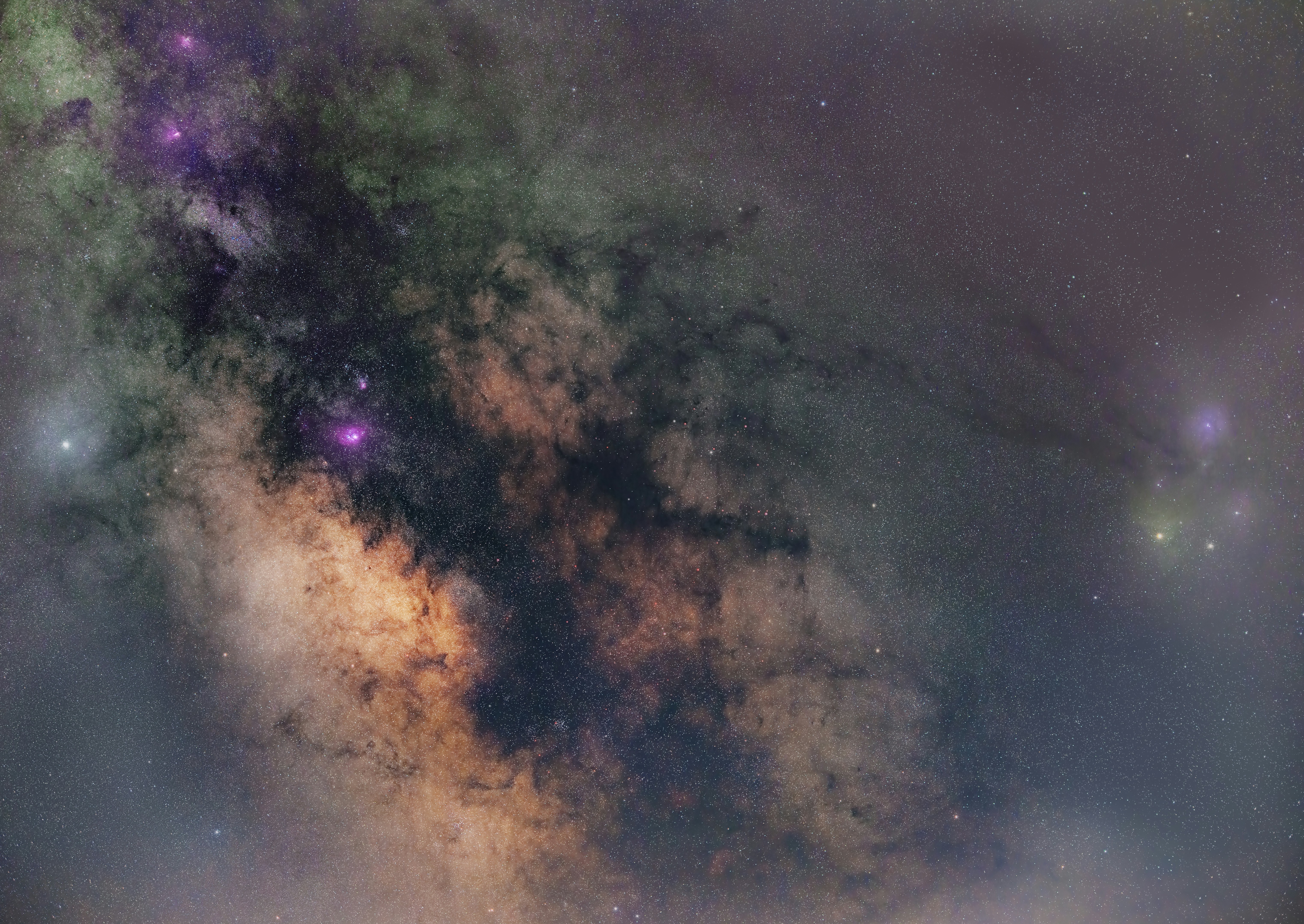 A vibrant cosmic sky with stars and colorful nebulae.