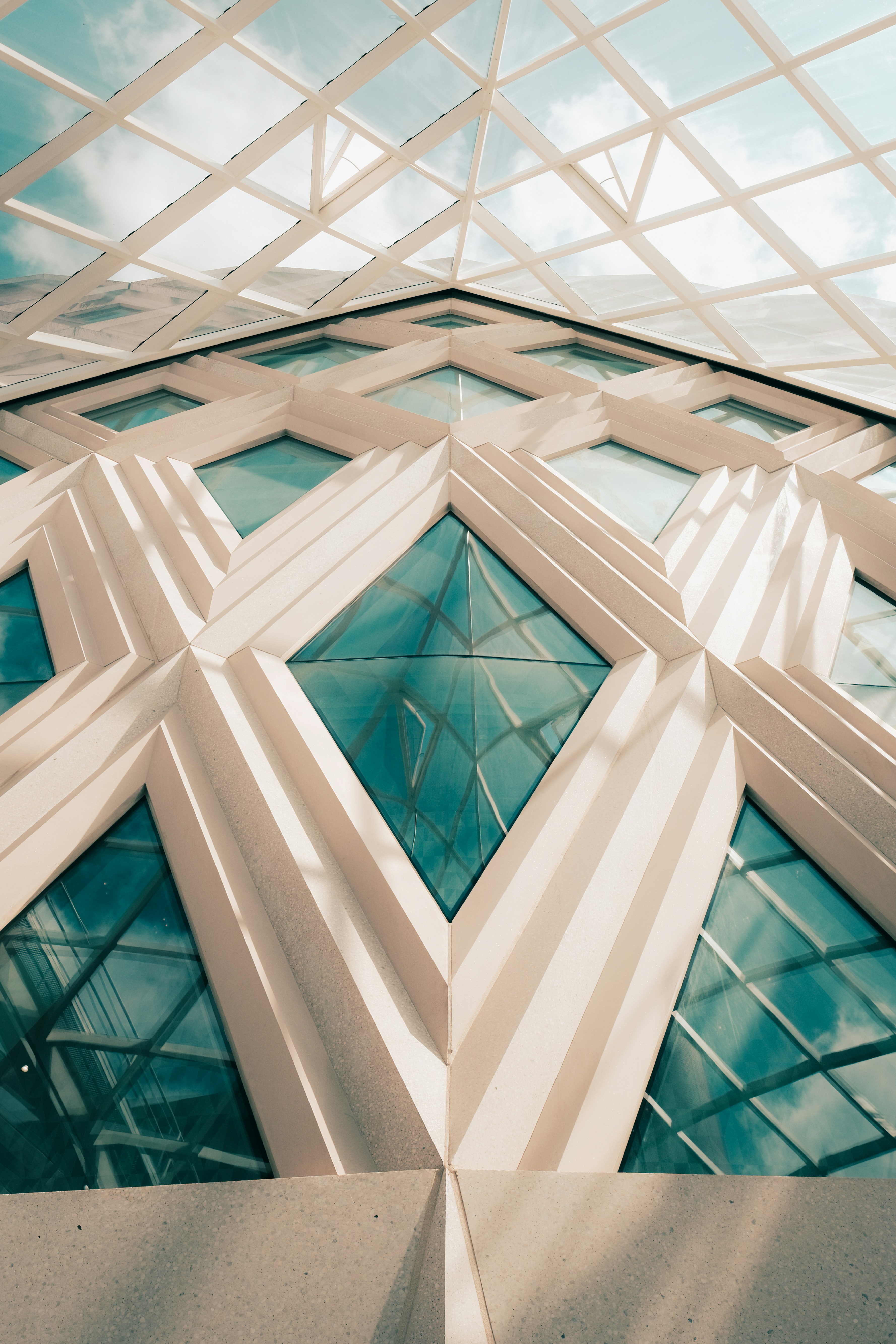 Striking modern architecture with diamond patterns and blue glass.