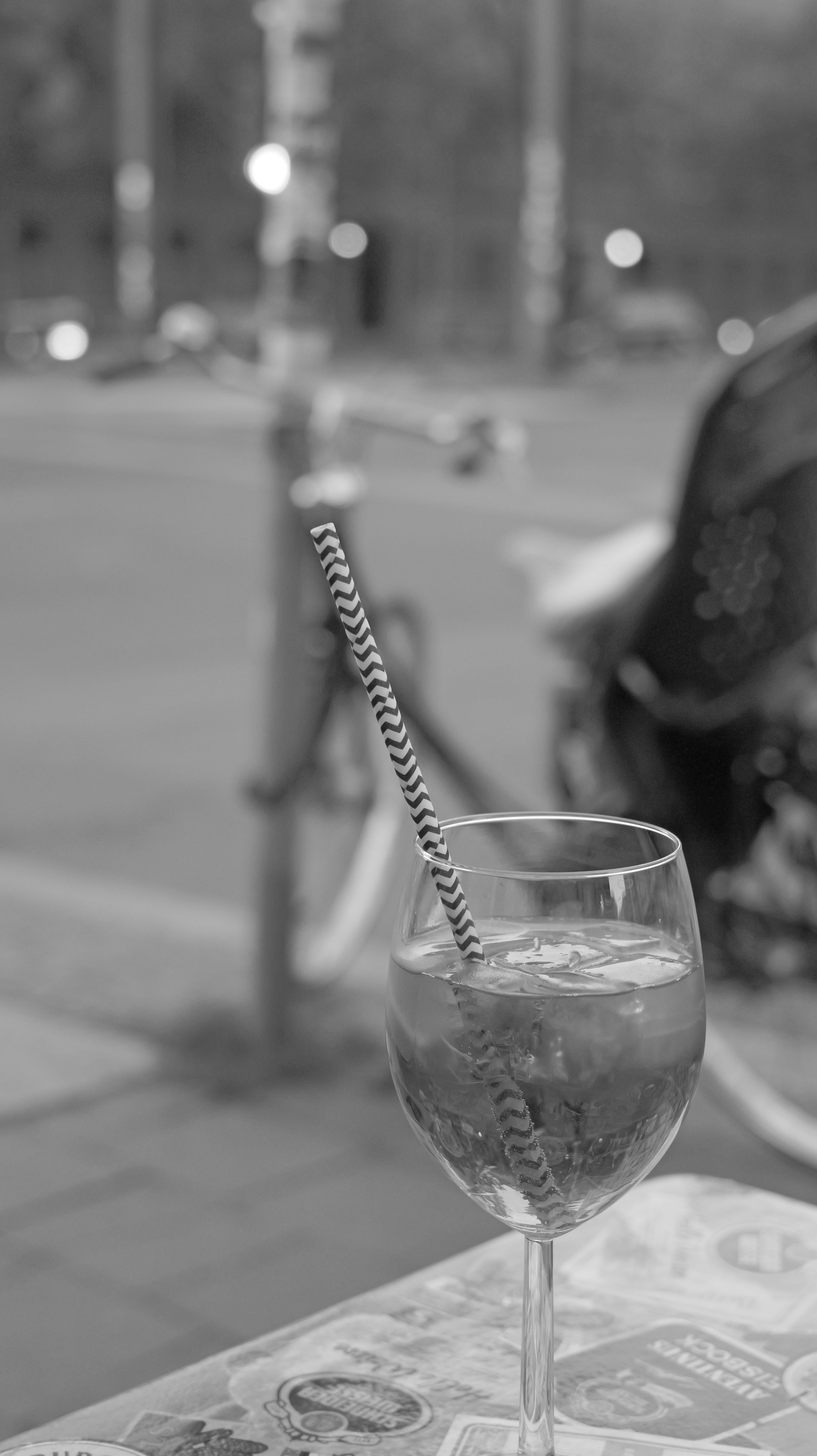 Drink with striped straw on a table, black and white - drink-with-striped-straw-on-a-table-black-and-white-QYyqQa-rplk