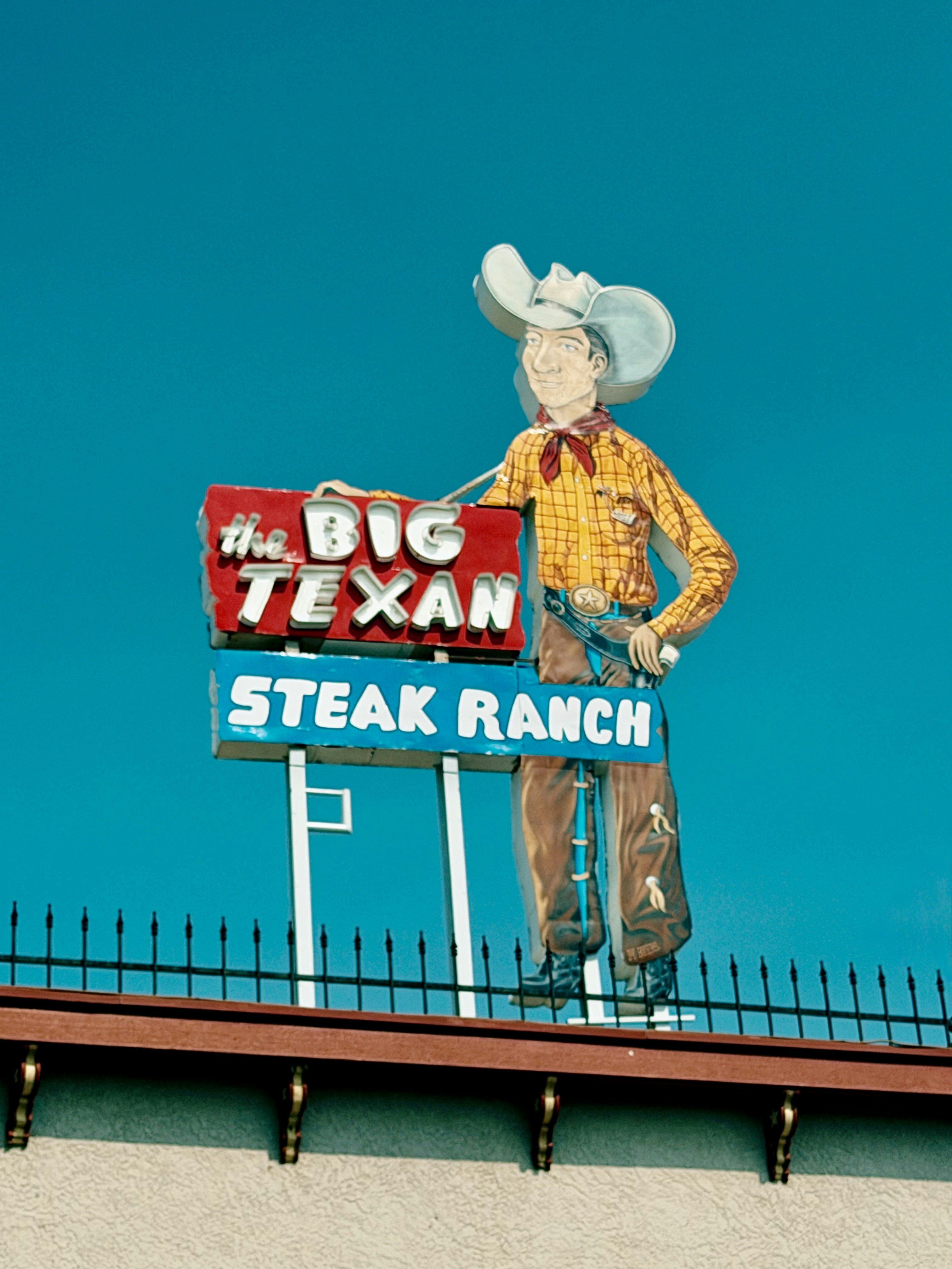 The big texan steak ranch sign with a cowboy figure