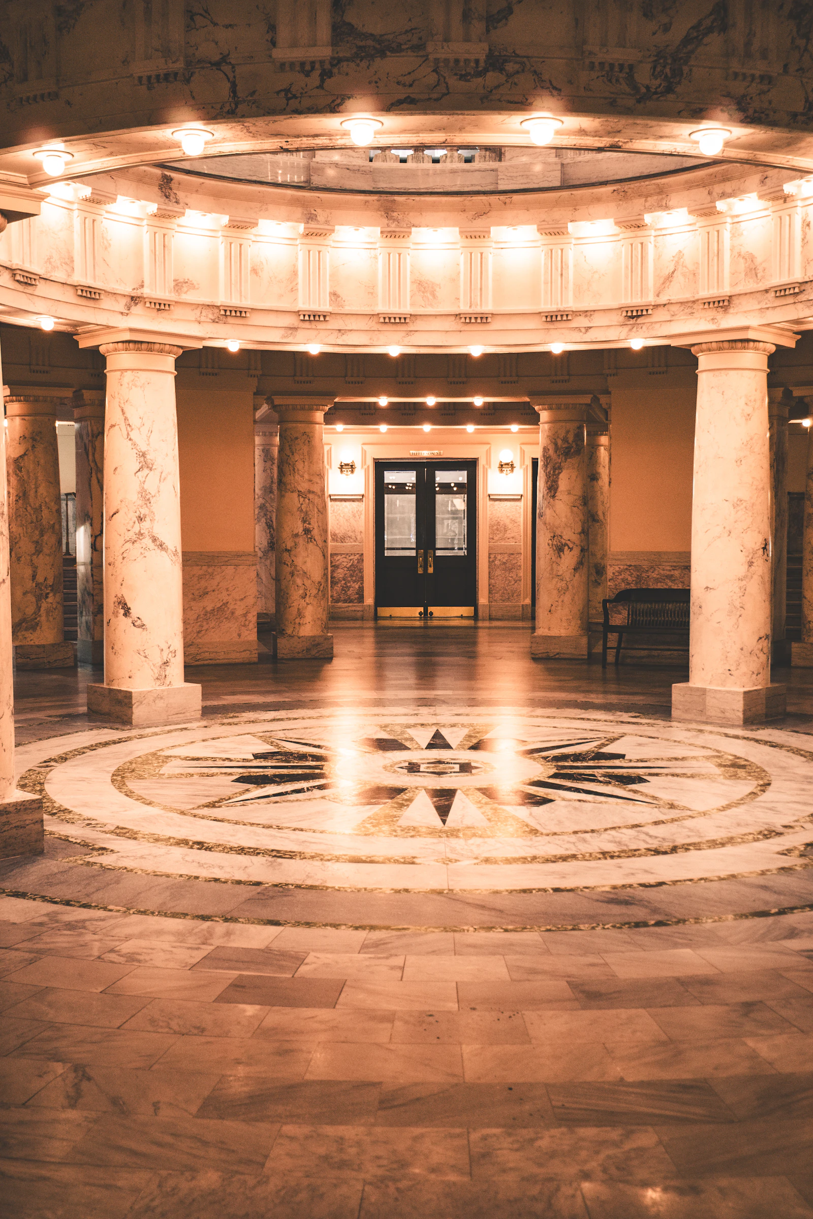 Interior of a government building with marble columns and polished stone floors