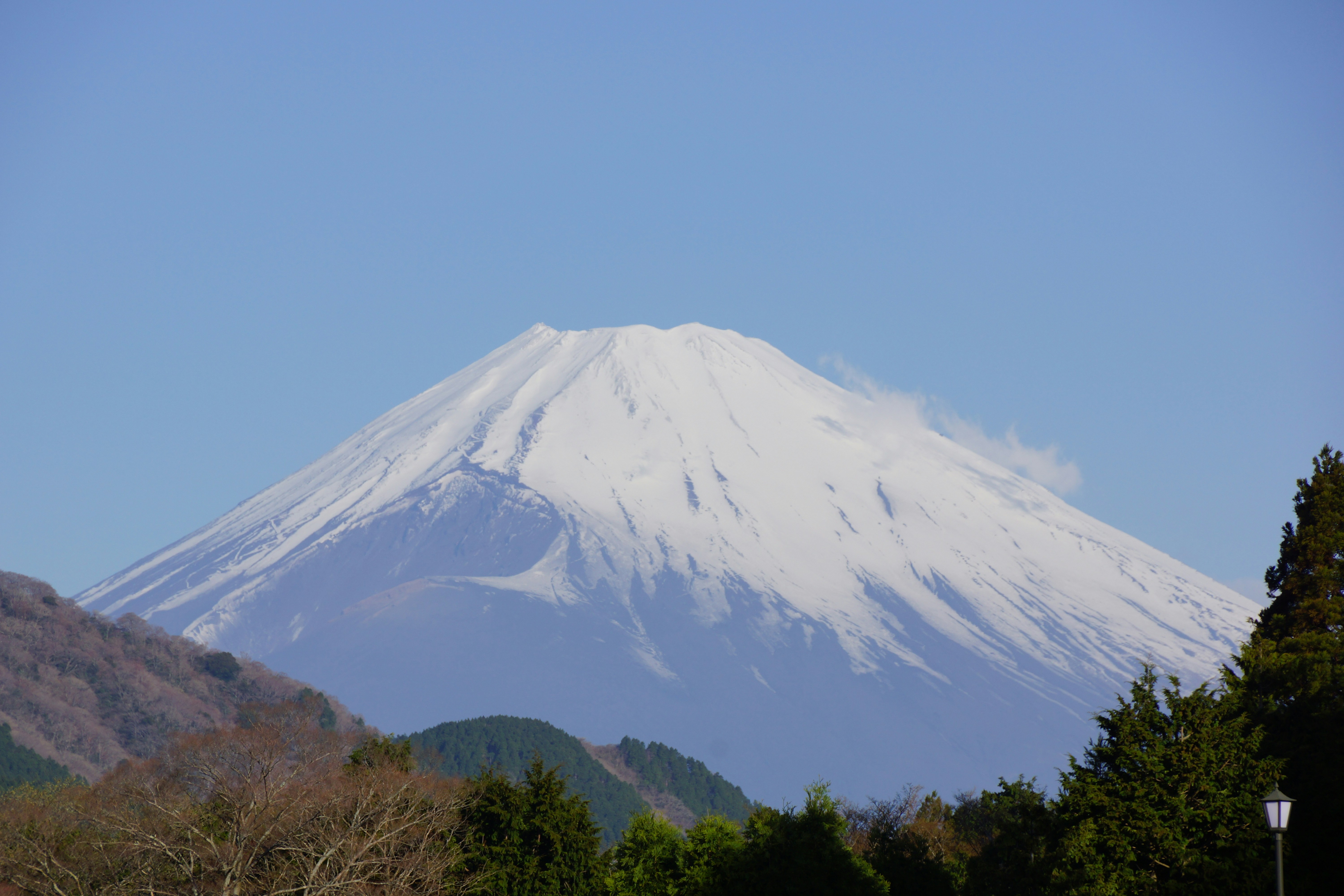 Mount fuji with snow-capped peak under a clear blue sky.