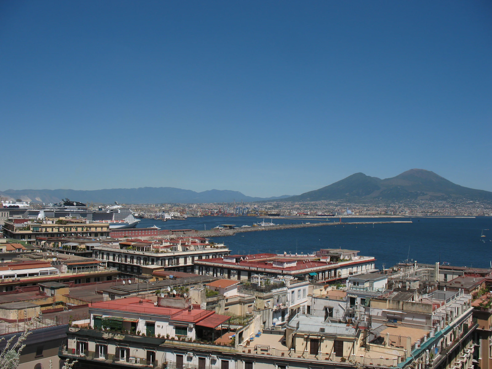 Urban landscape with a bay and distant mountain