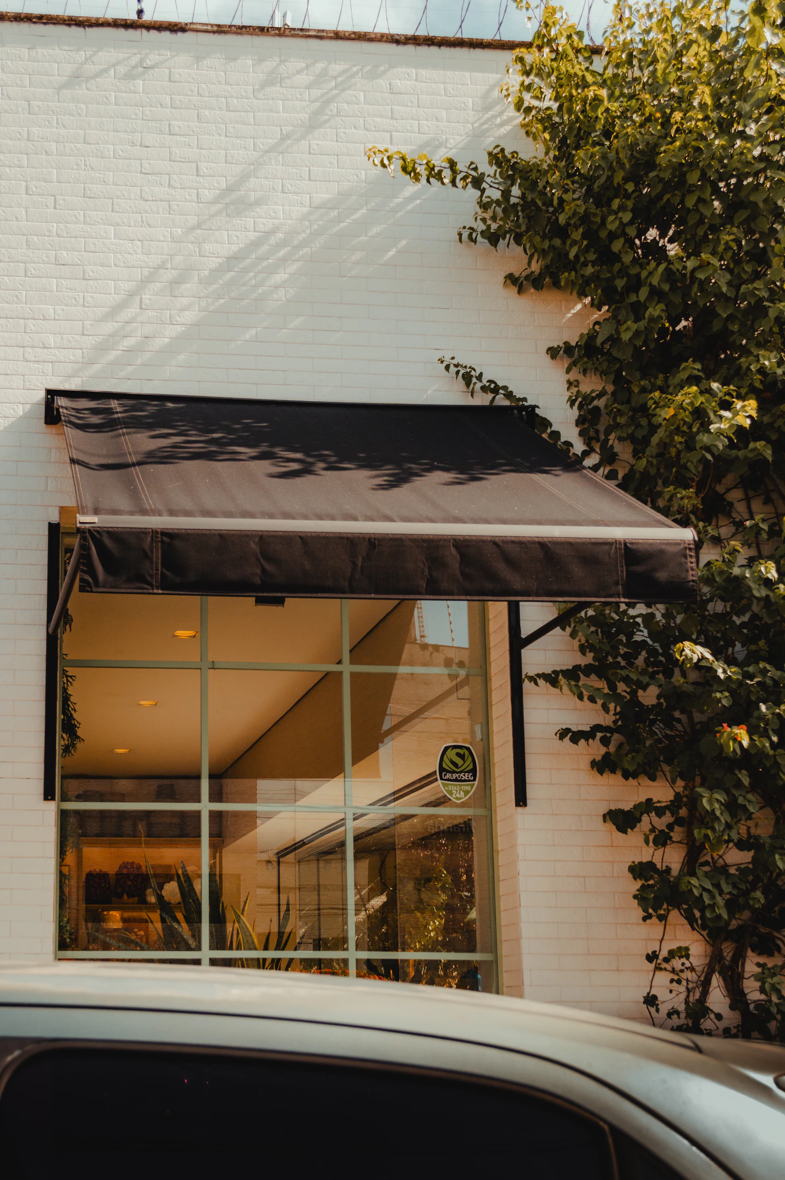 A brick commercial building with an awning