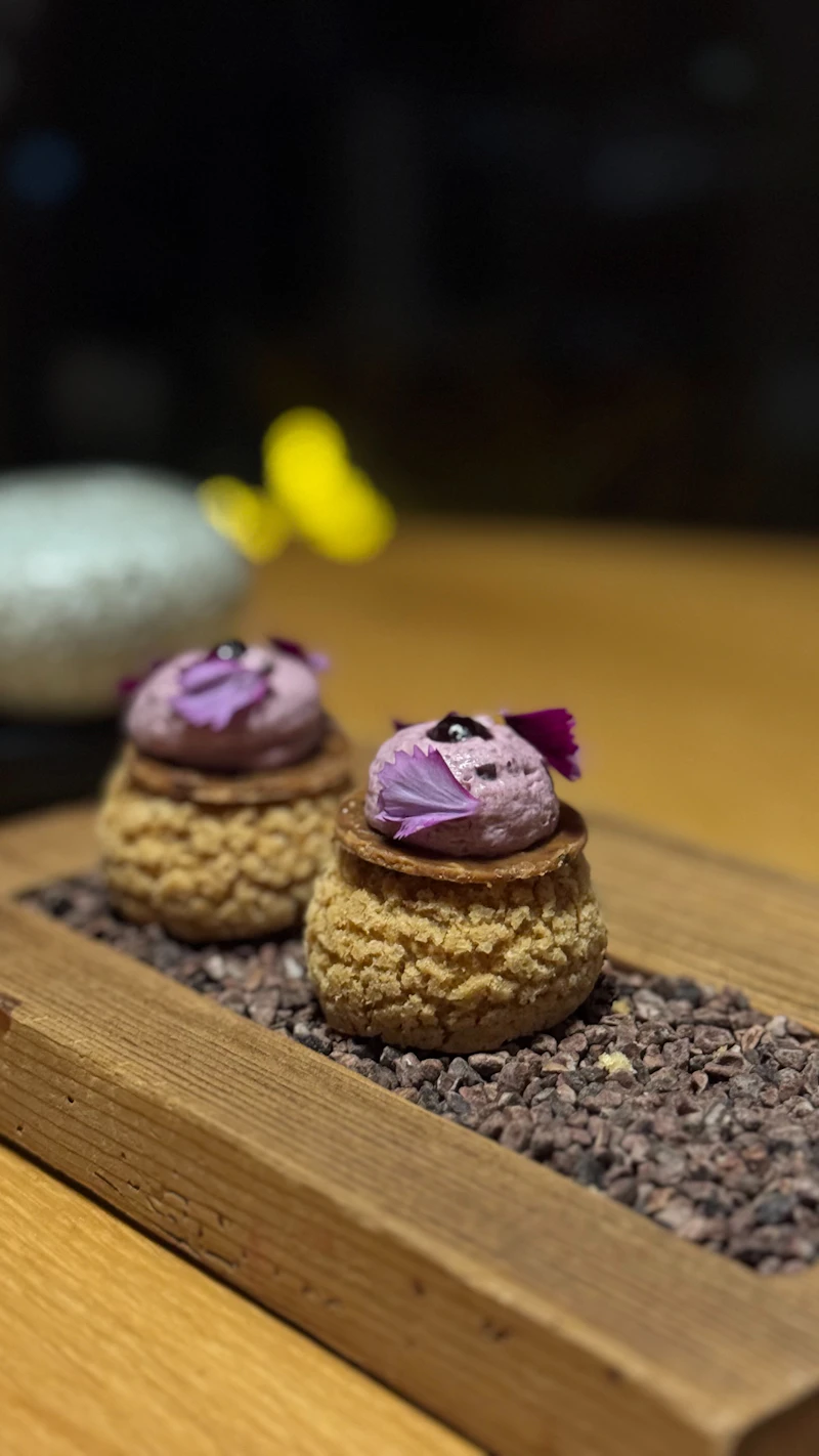 Choux pastry dessert with edible flowers