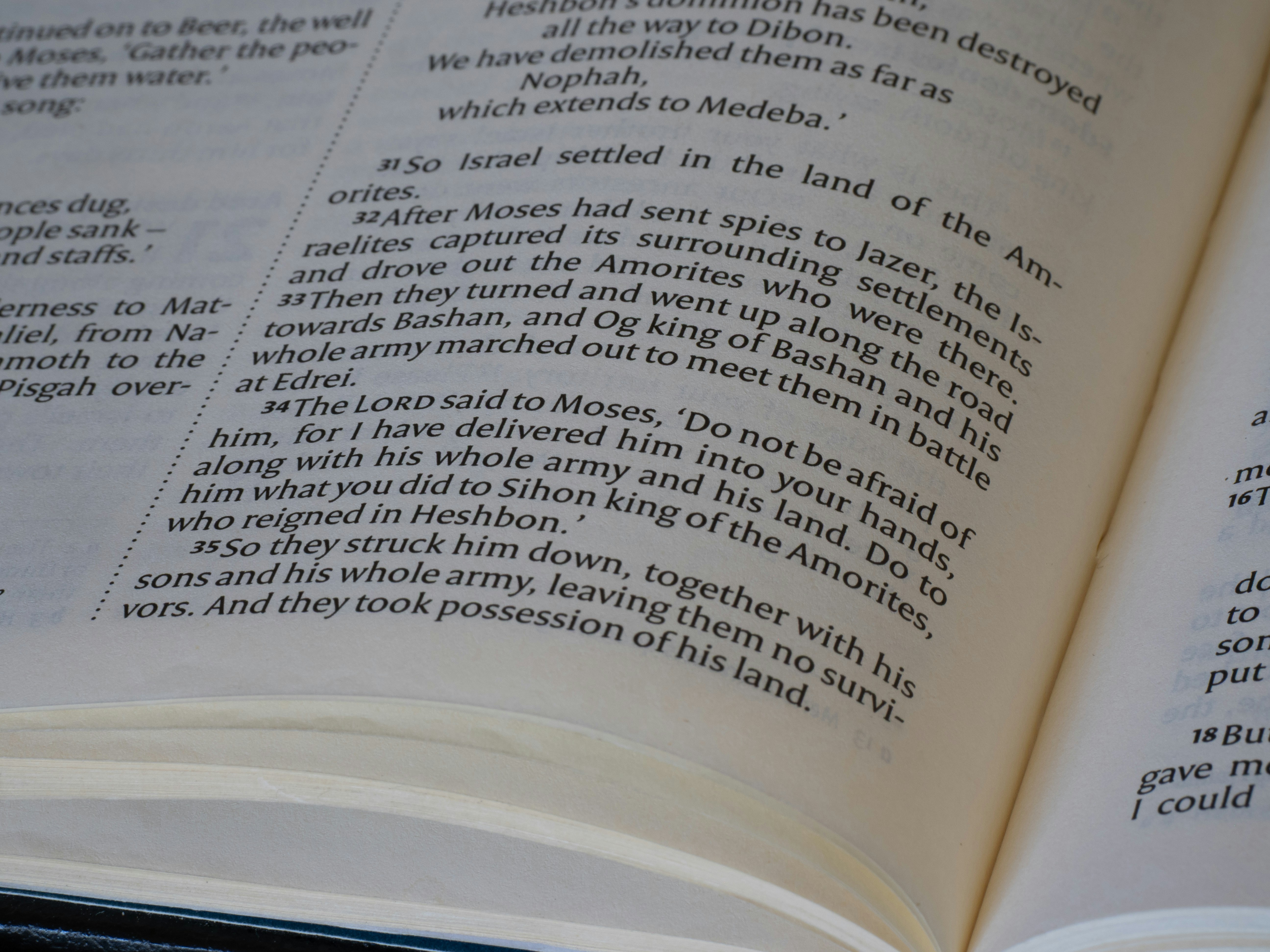 An open book with printed text on a white page.