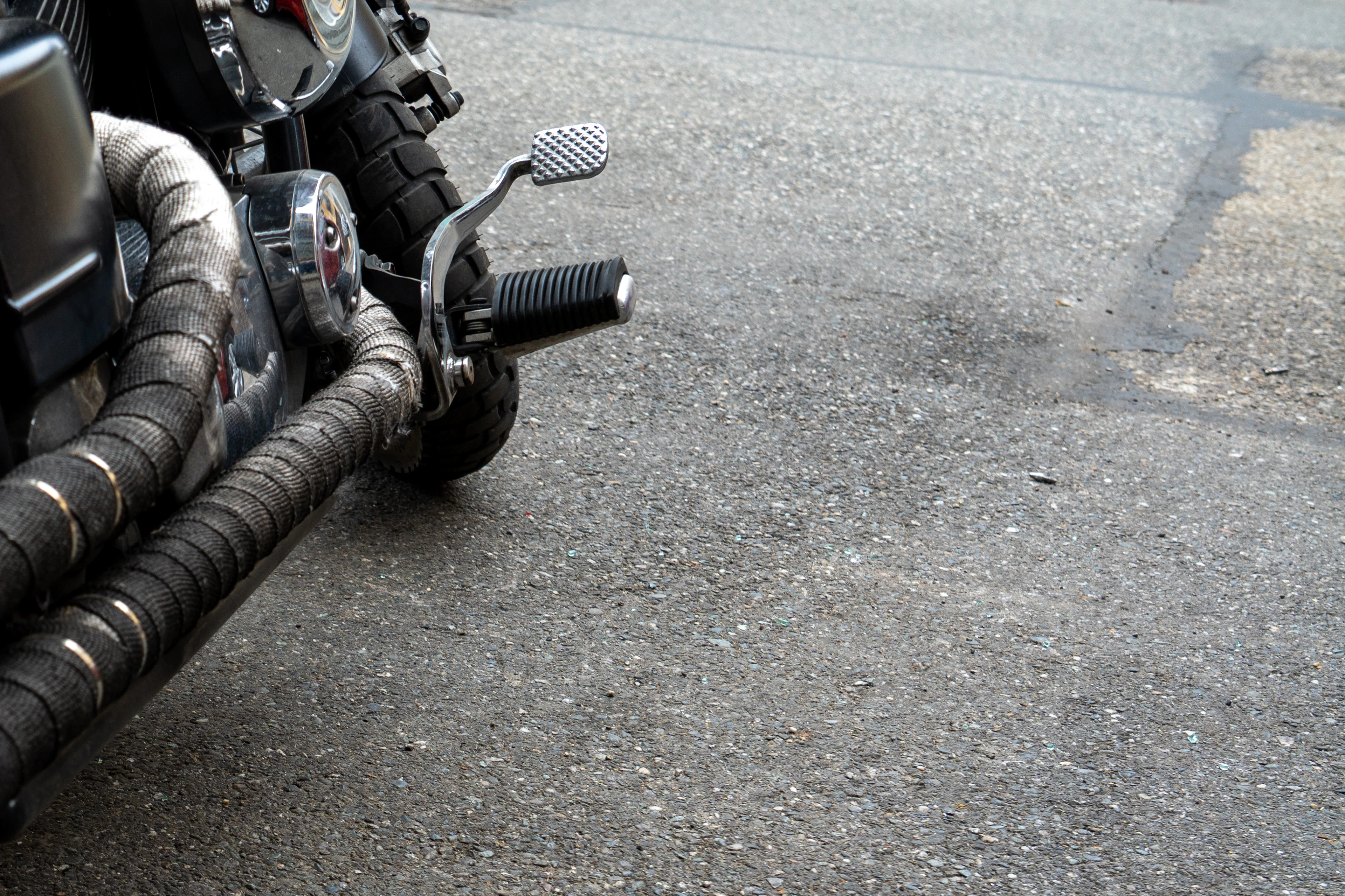 Motorcycle exhaust headers wrapped in heat-resistant wrap