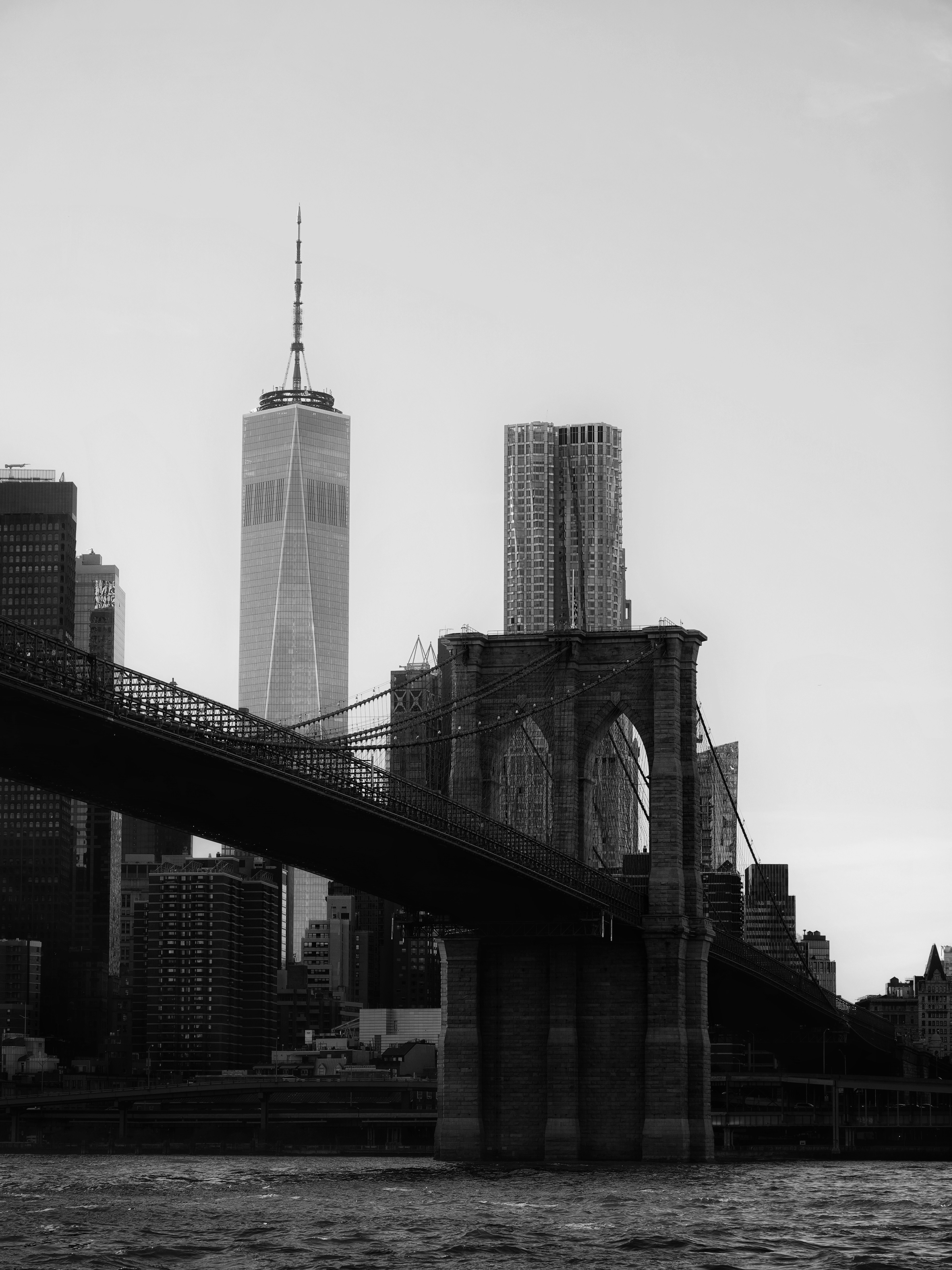 Iconic brooklyn bridge with new york city skyline.