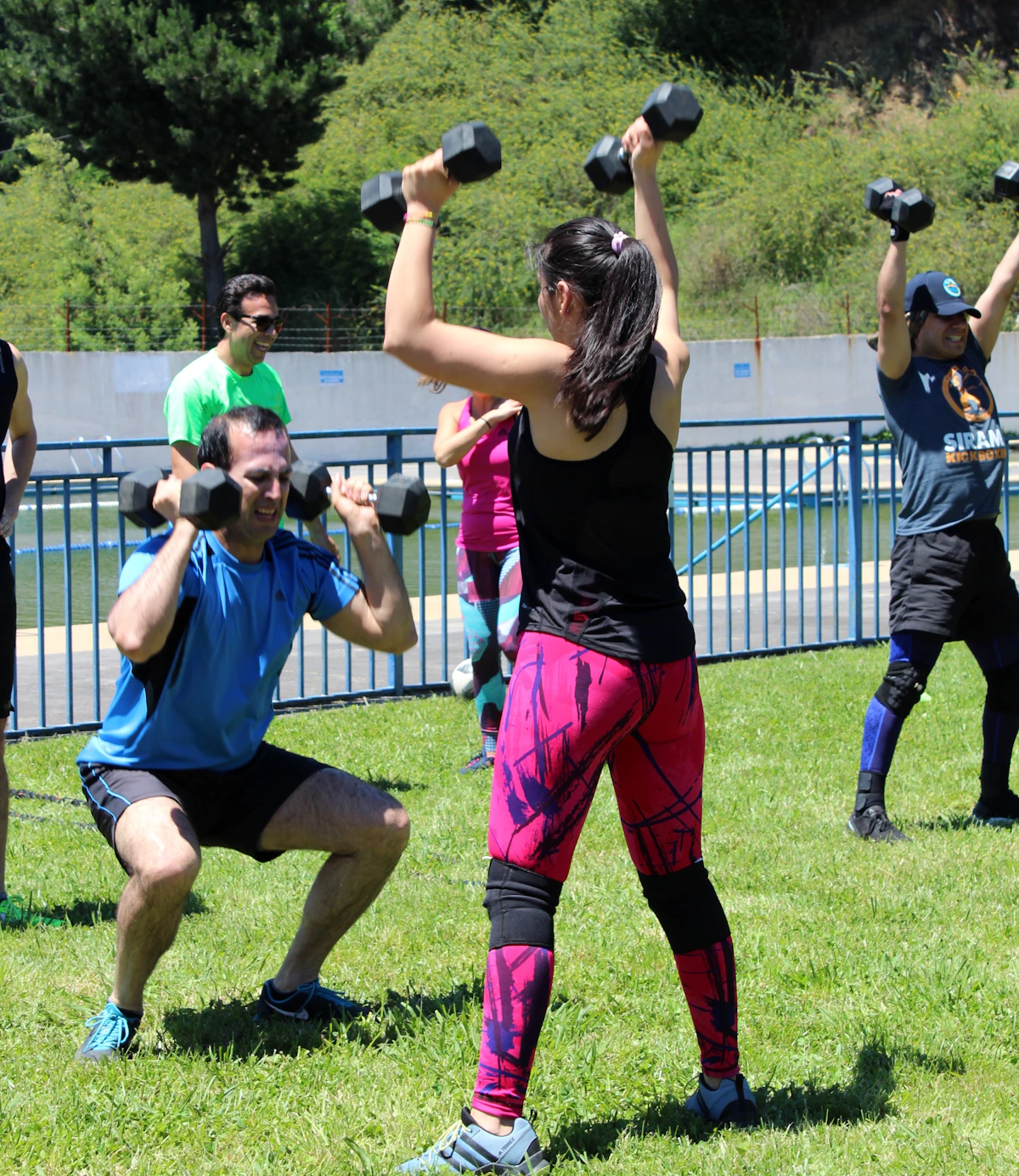 Friends enjoying an outdoor strength workout together