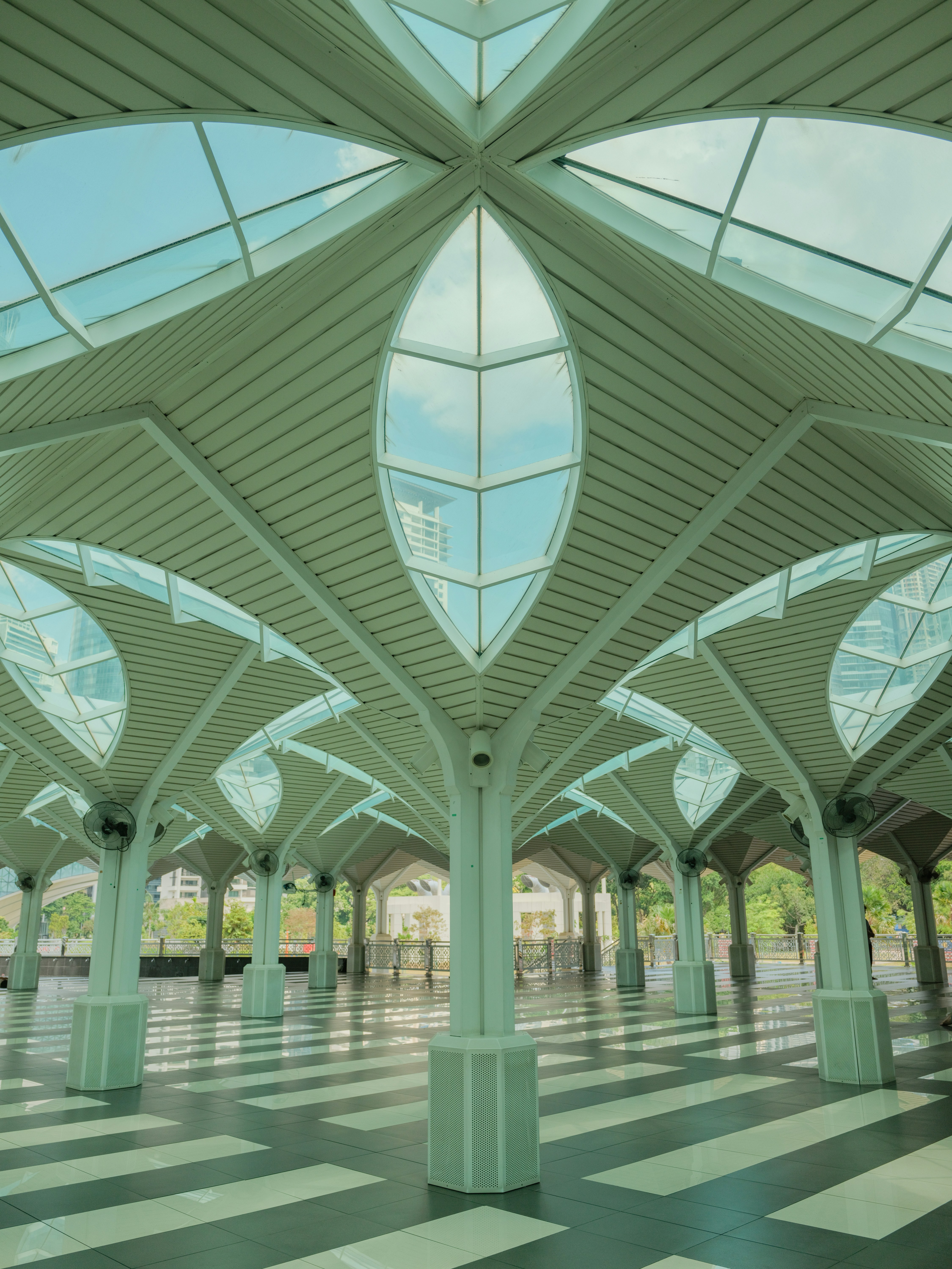 Modern architectural structure with leaf-shaped glass roof