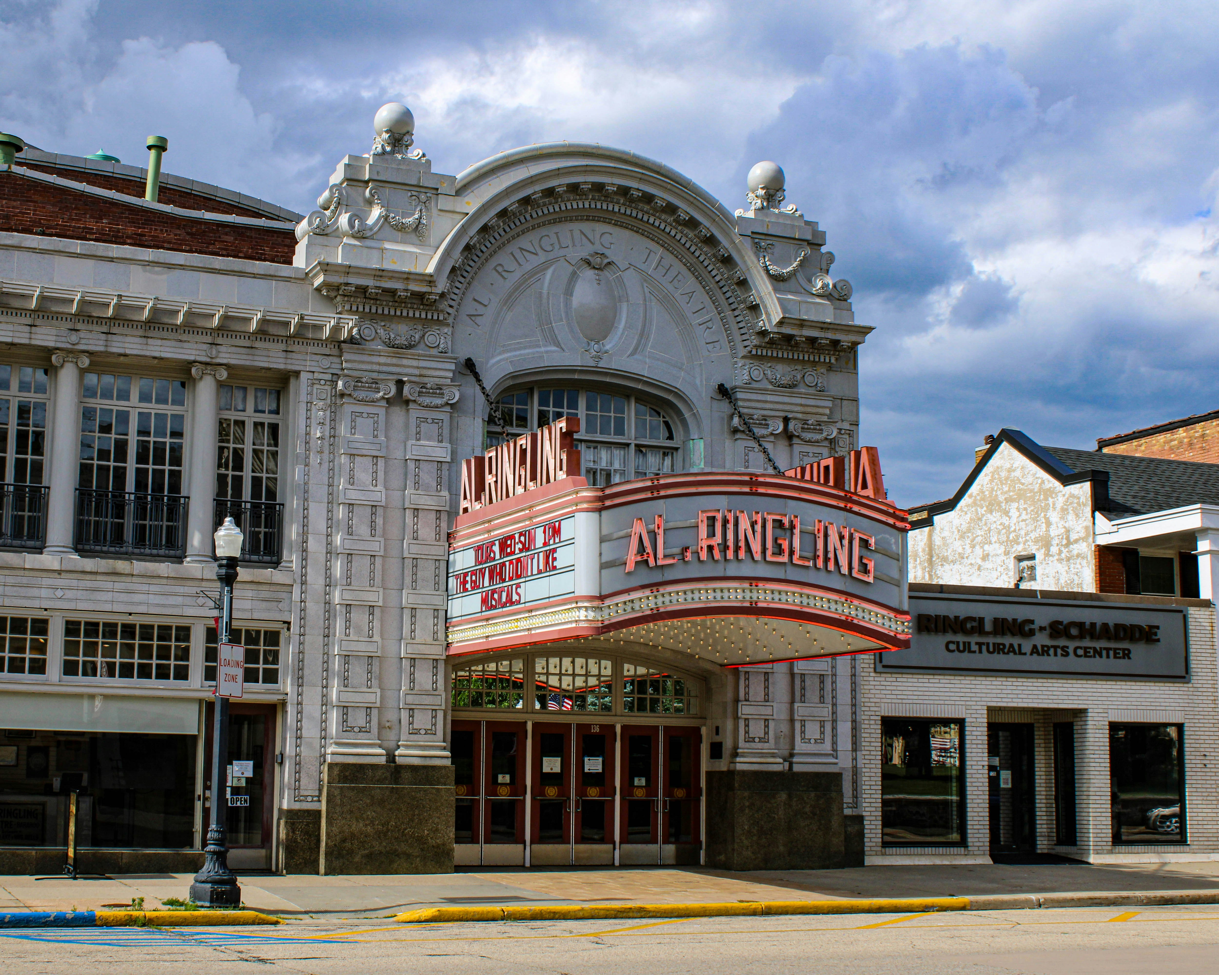 An ornate theater building with "al ringling" on its marquee.