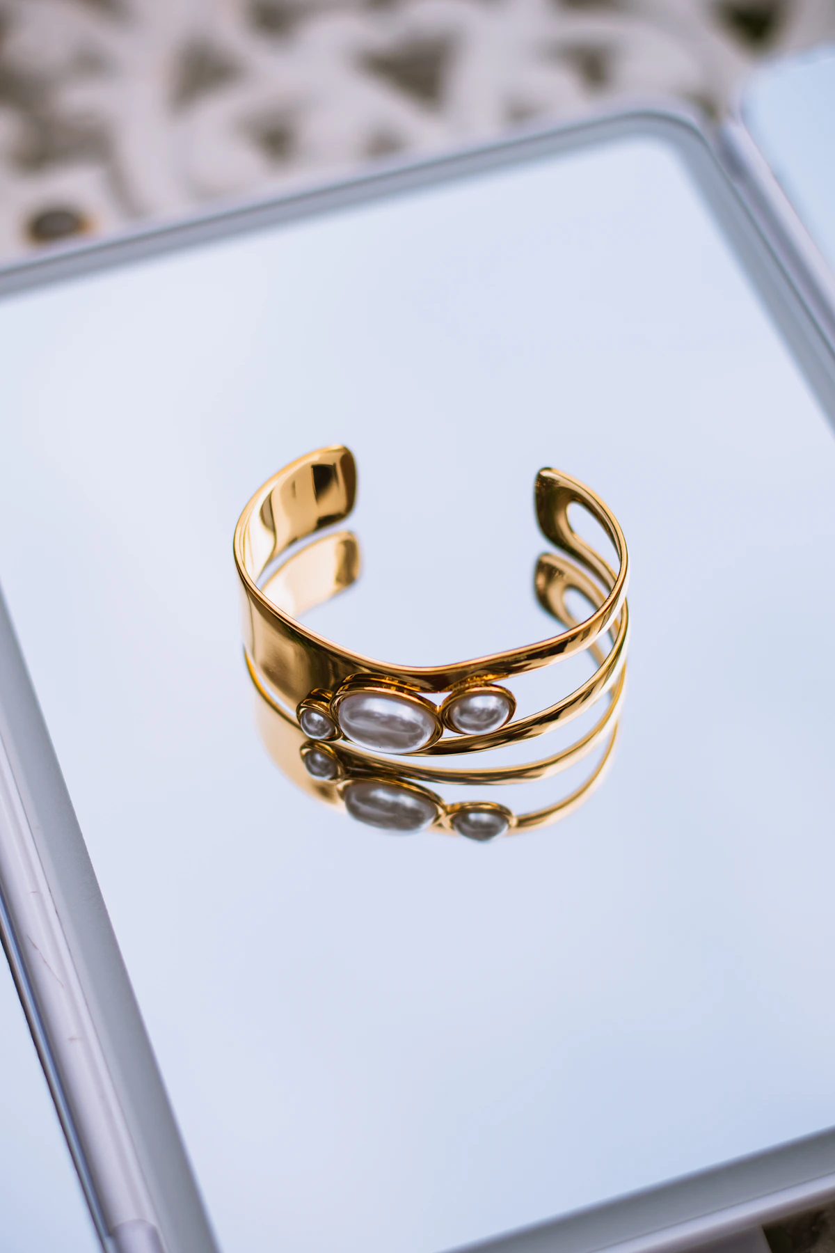 Elegant gold cuff bracelet with pearls