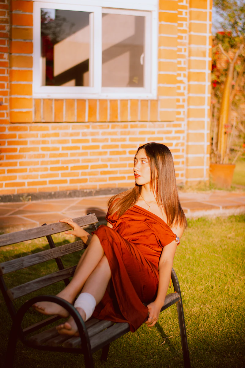 Patient with a bandaged ankle sitting on a bench