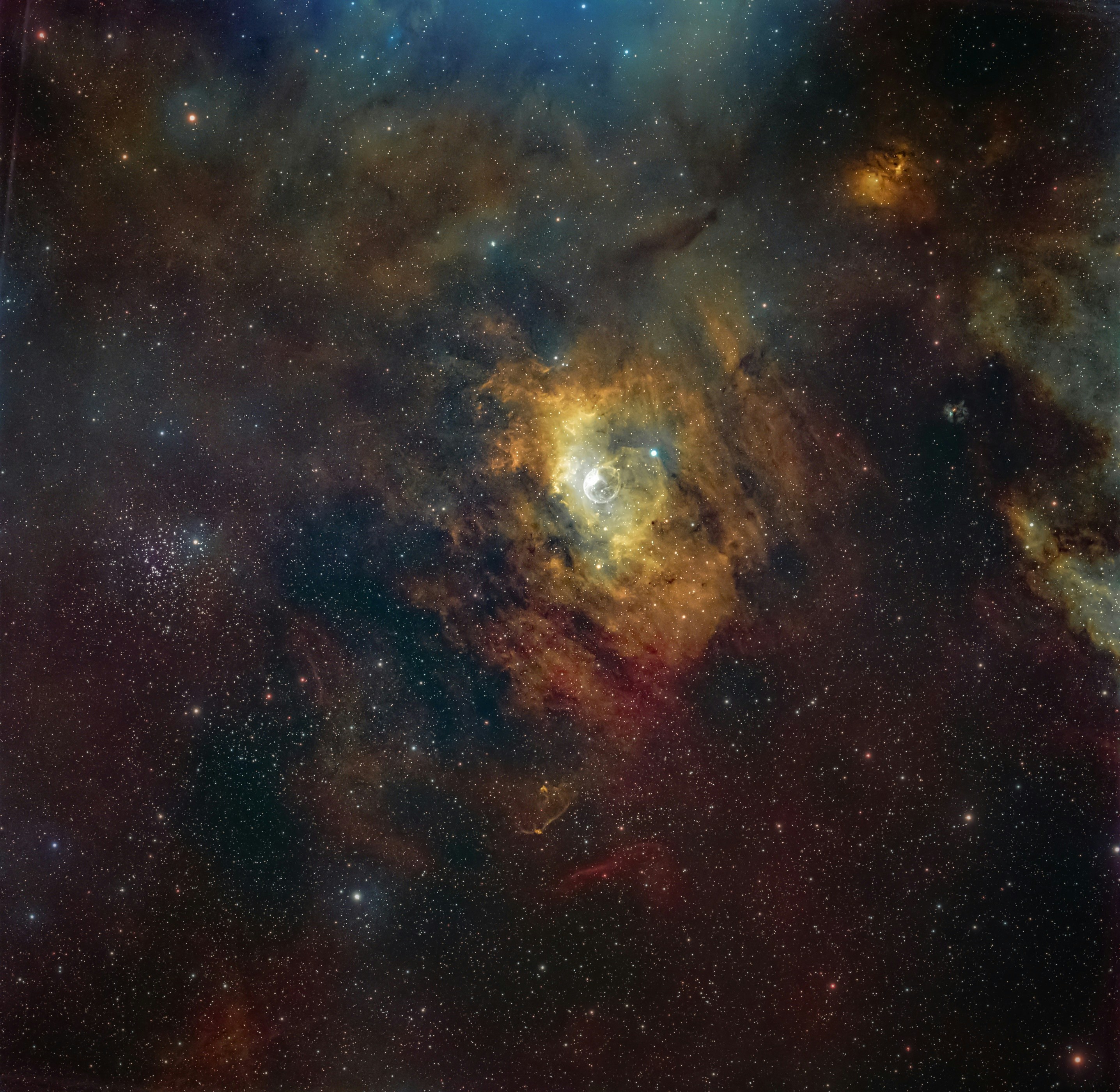 Bubble nebula glowing brightly among scattered stars